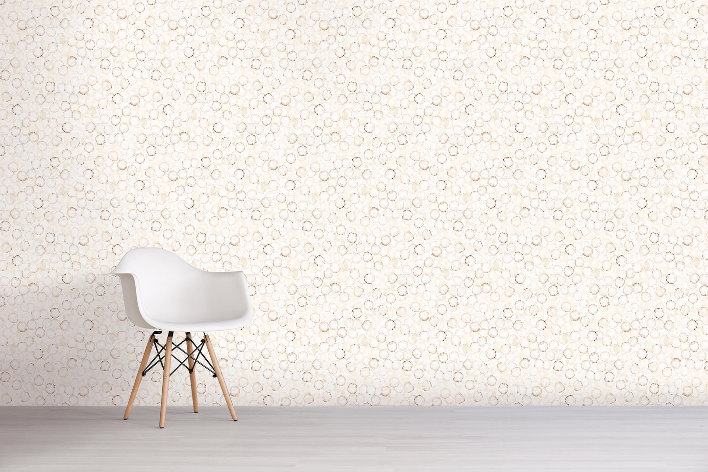 White chair against a tan light-colored wall with a subtle pattern