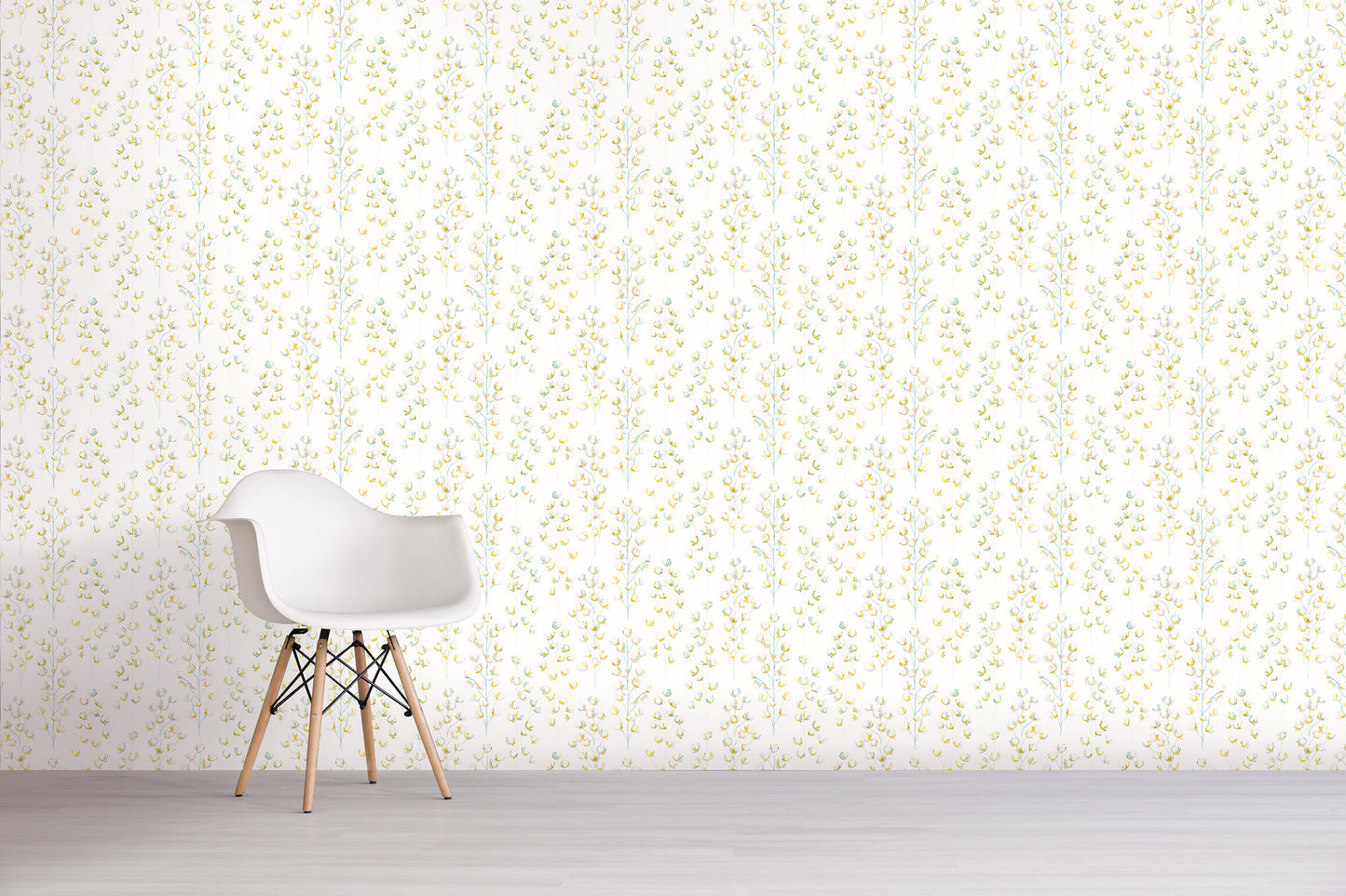 White chair in front of a green light-colored wall with subtle pattern