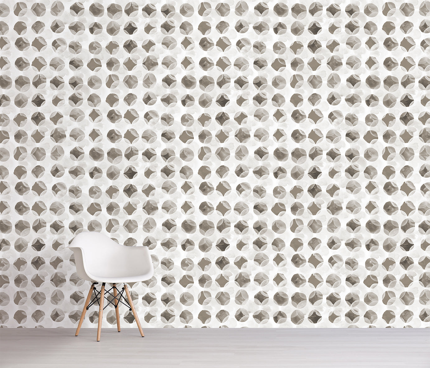 Wallpaper with geometric pattern in neutral colors, featuring a chair against the wall.