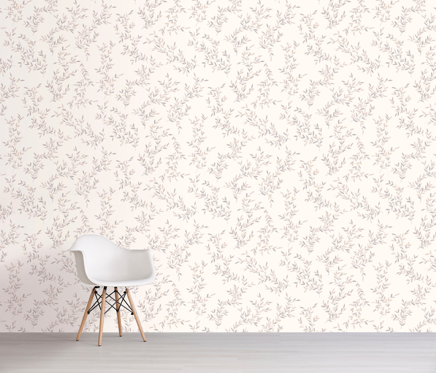White chair against a cream floral patterned wall.