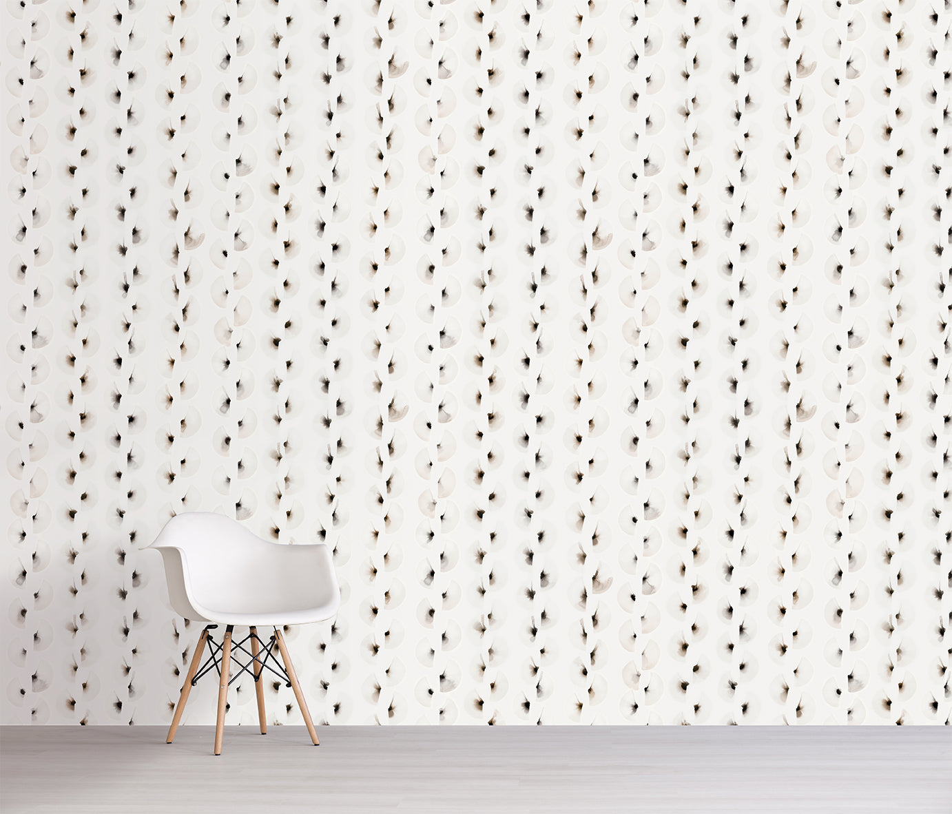 White chair in front of a wall with a subtle brown linear pattern