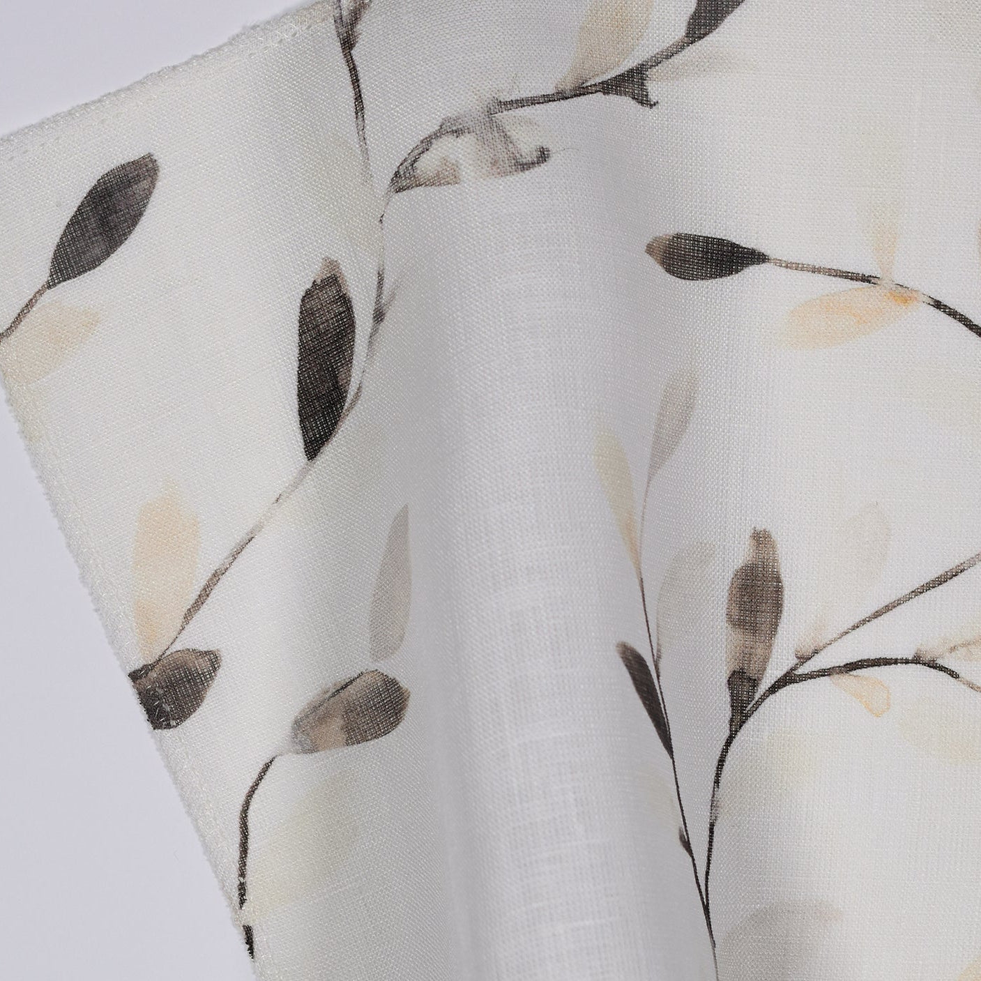Neutral fabric leaves on light sheer fabric