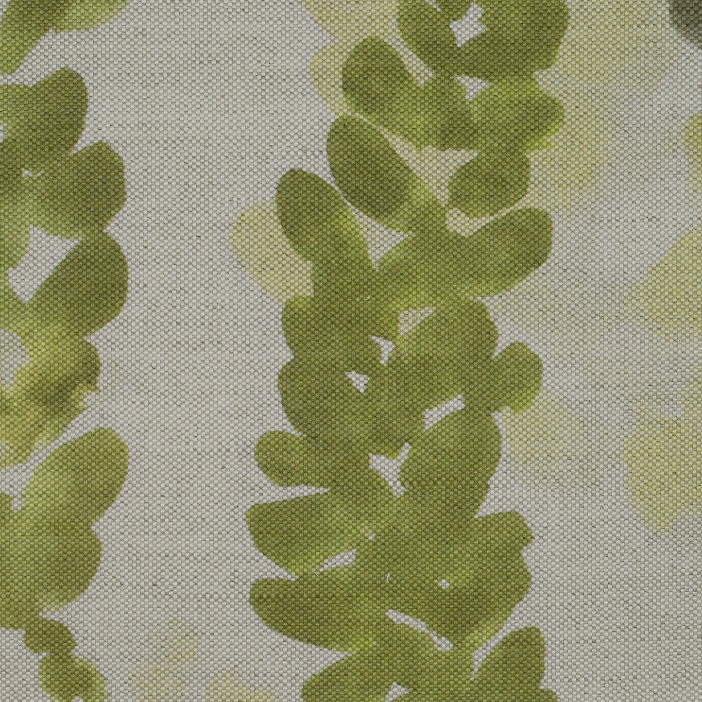 Fabric with green leaf pattern on a oatmeal background