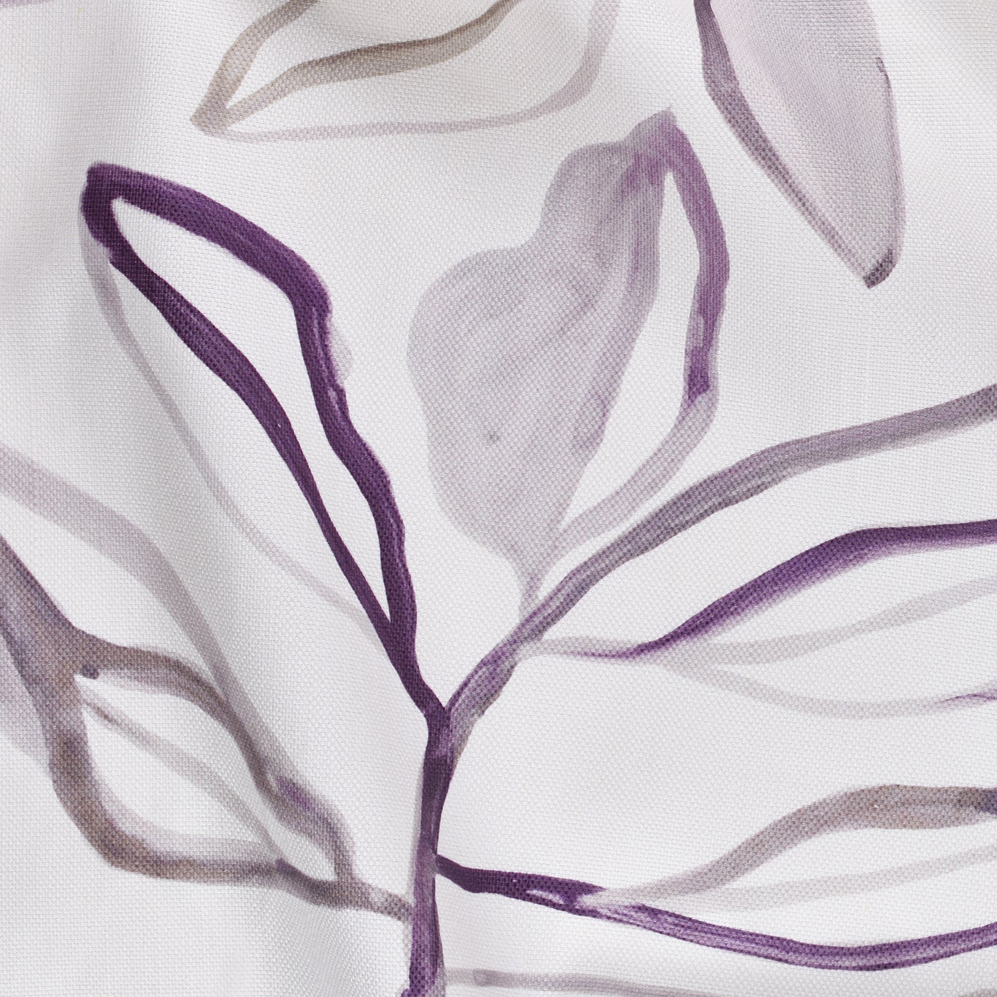 Close-up of a fabric with purple leaf-like patterns on a white background