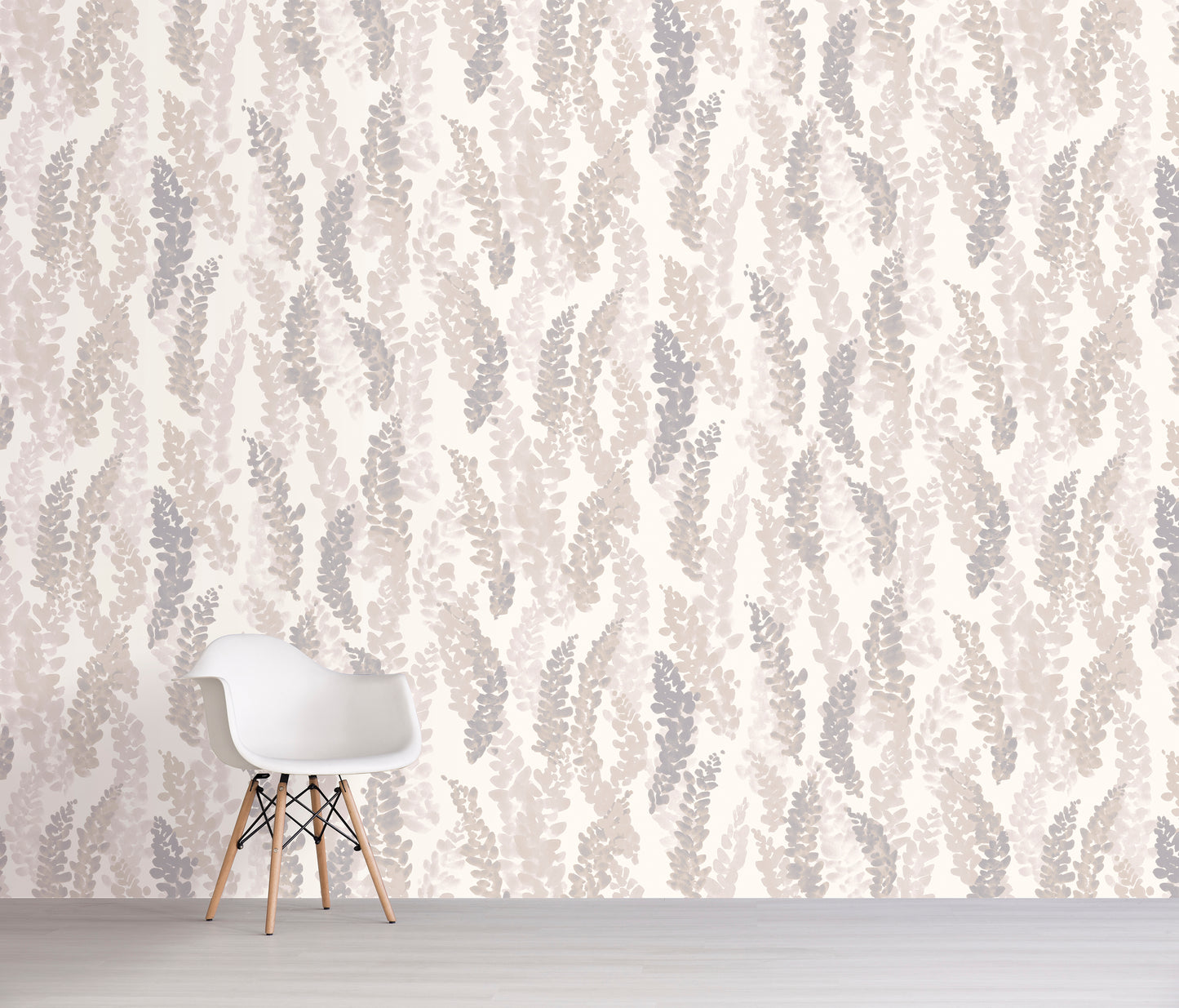 White chair against a wall with a cream colored floral pattern