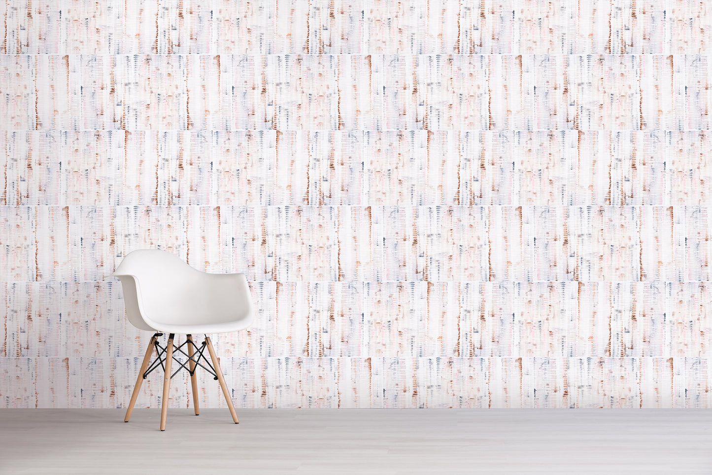 White chair against a pink and brown textured wall with vertical lines