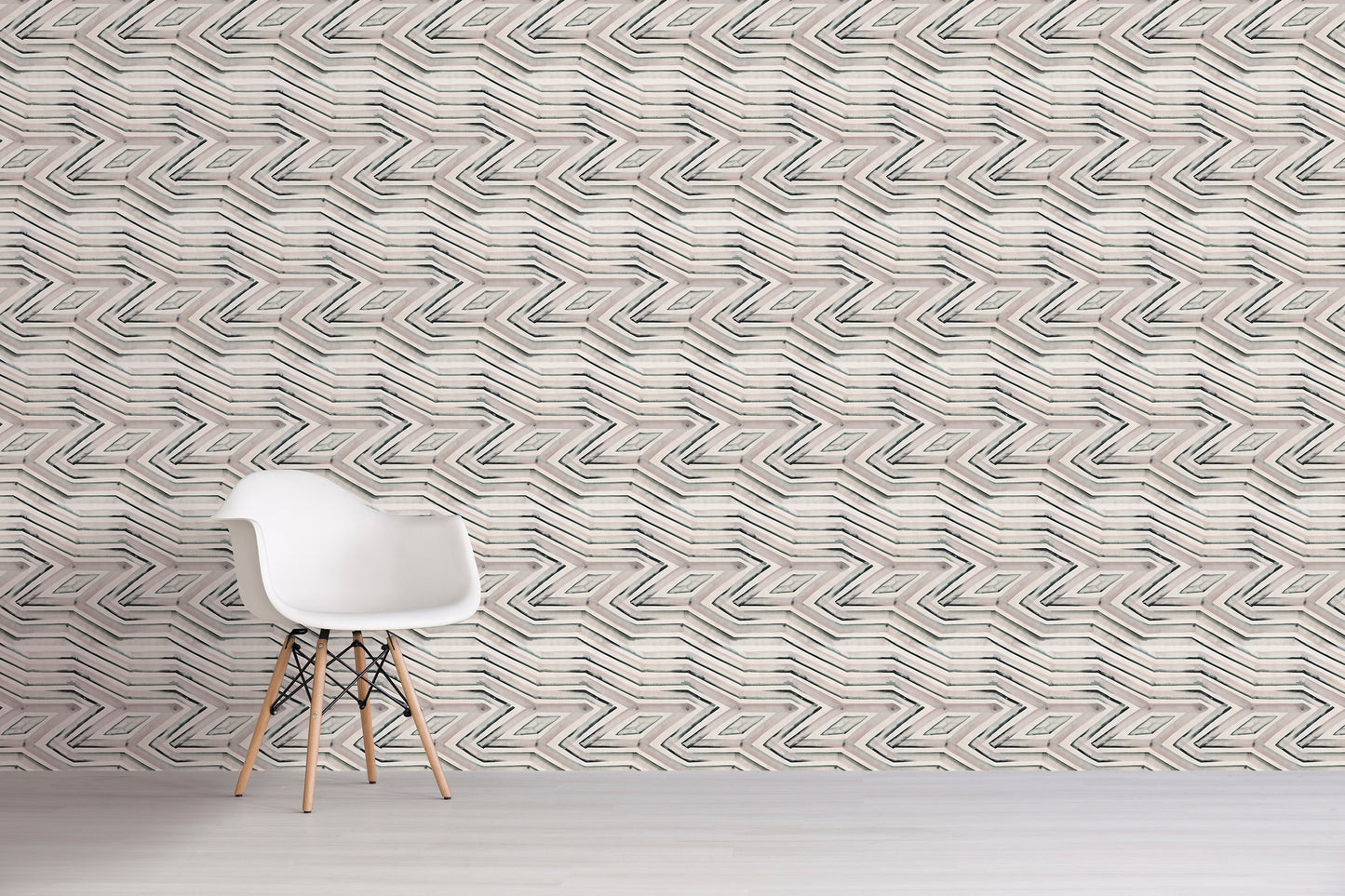 White chair in front of a textured wall with geometric pattern
