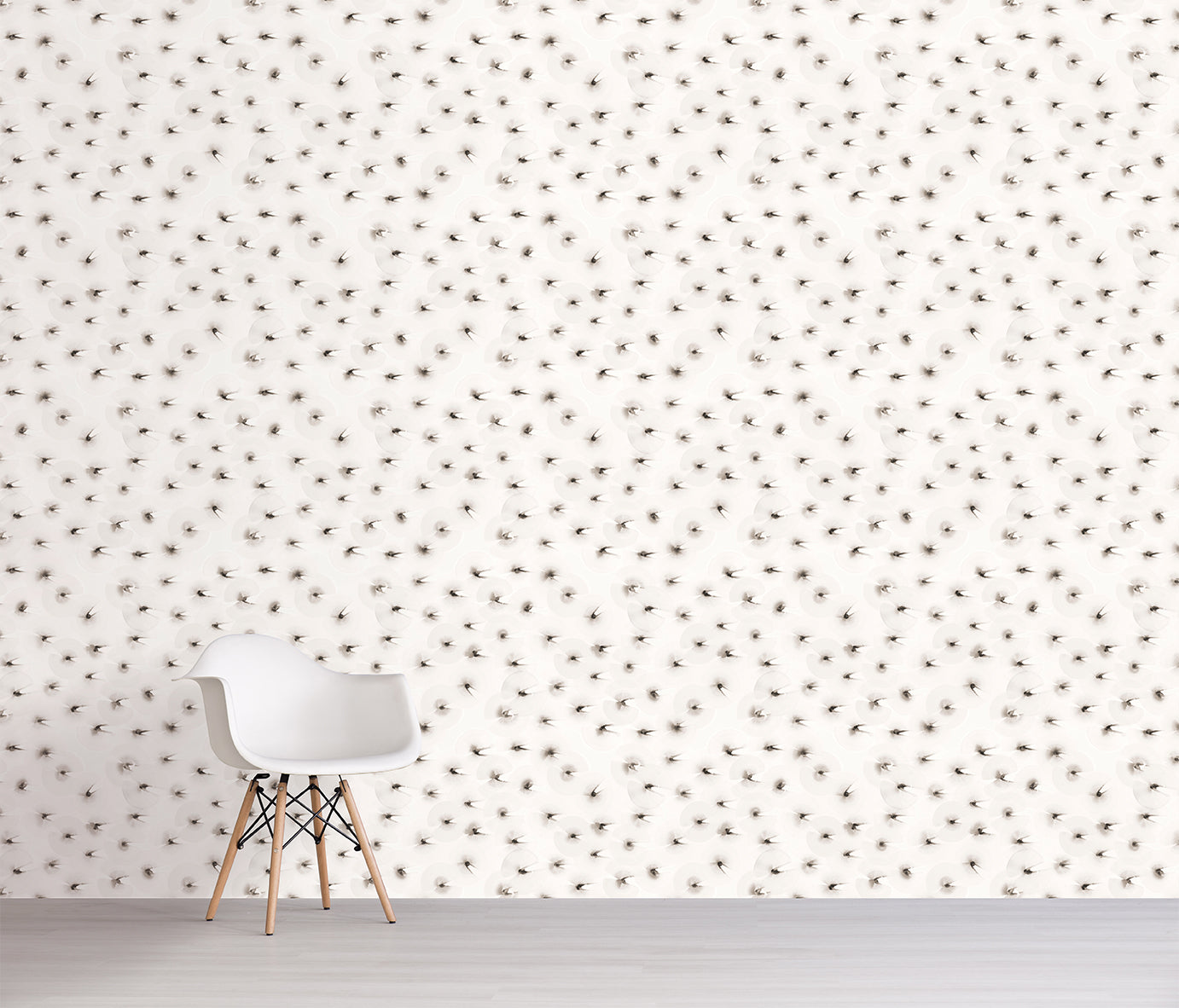 White chair in front of a wall with a subtle brown pattern