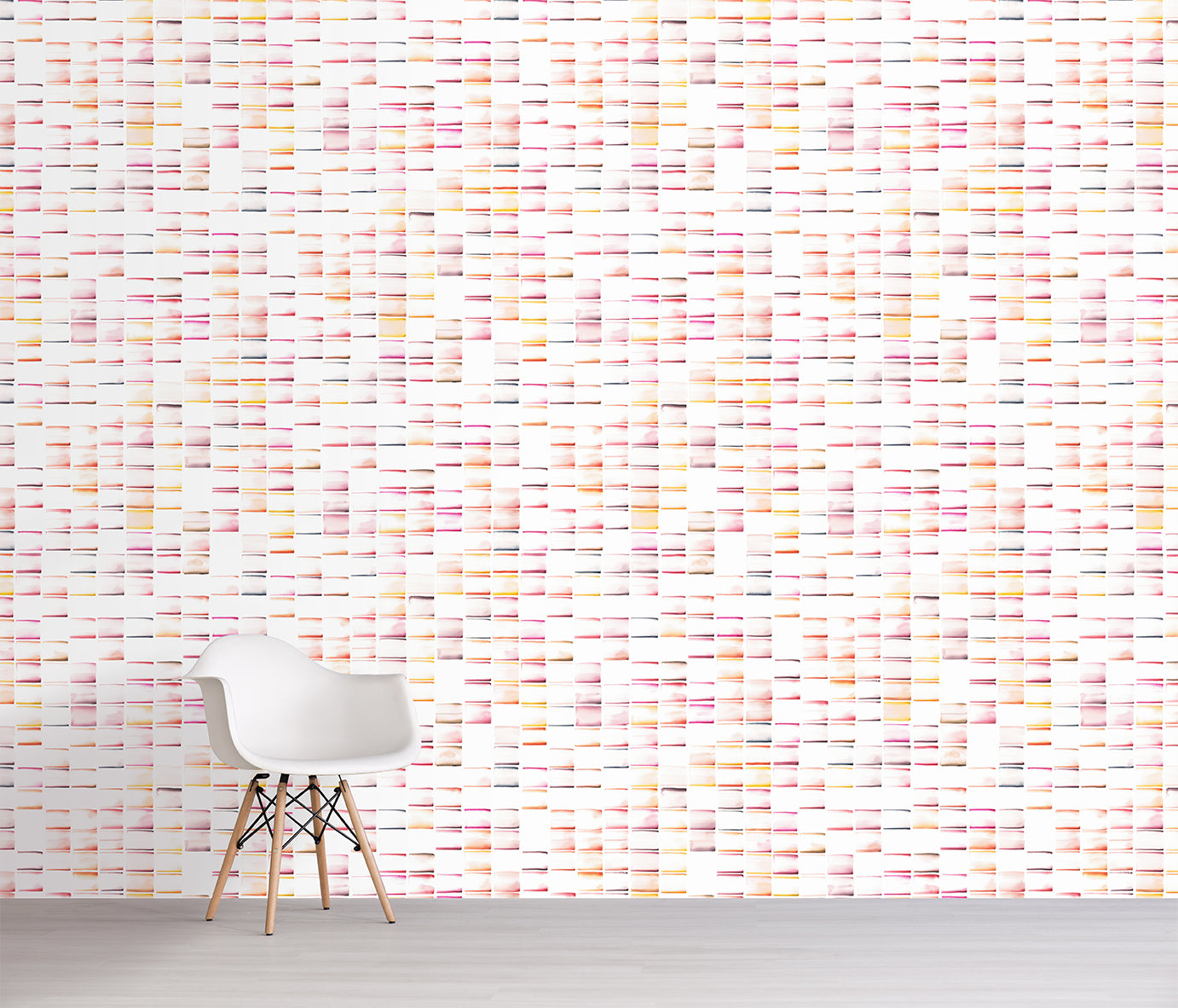 Wall with a pink patterned wallpaper and a chair in front