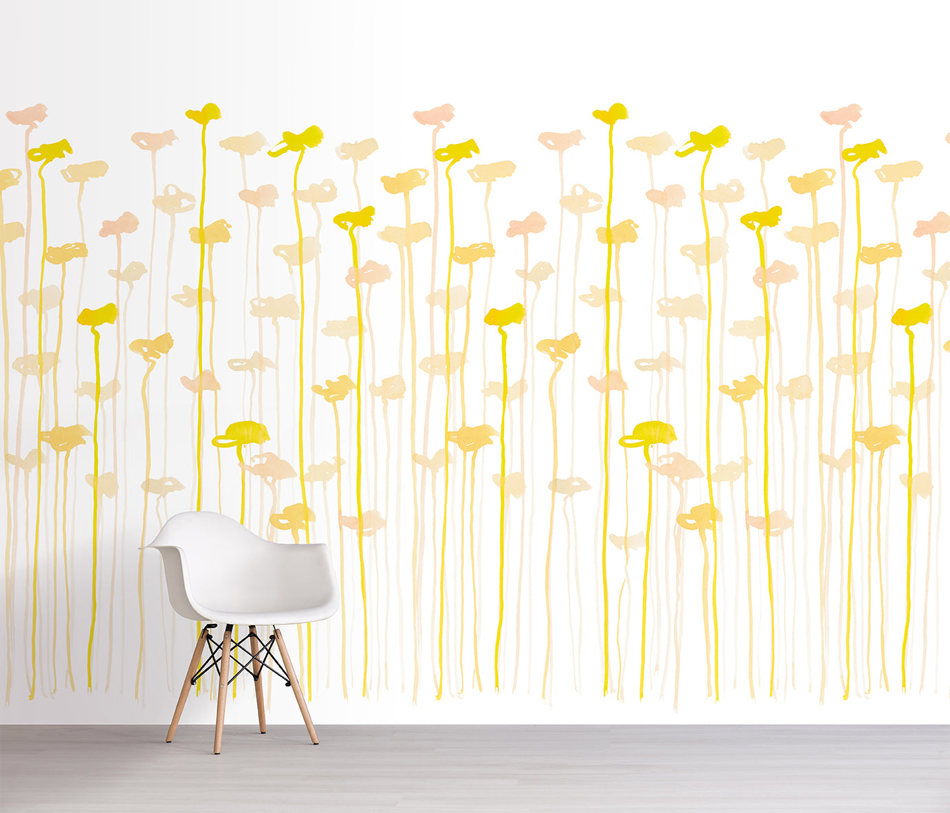 Wallpaper with yellow and pink floral pattern on a white wall with a chair in front.