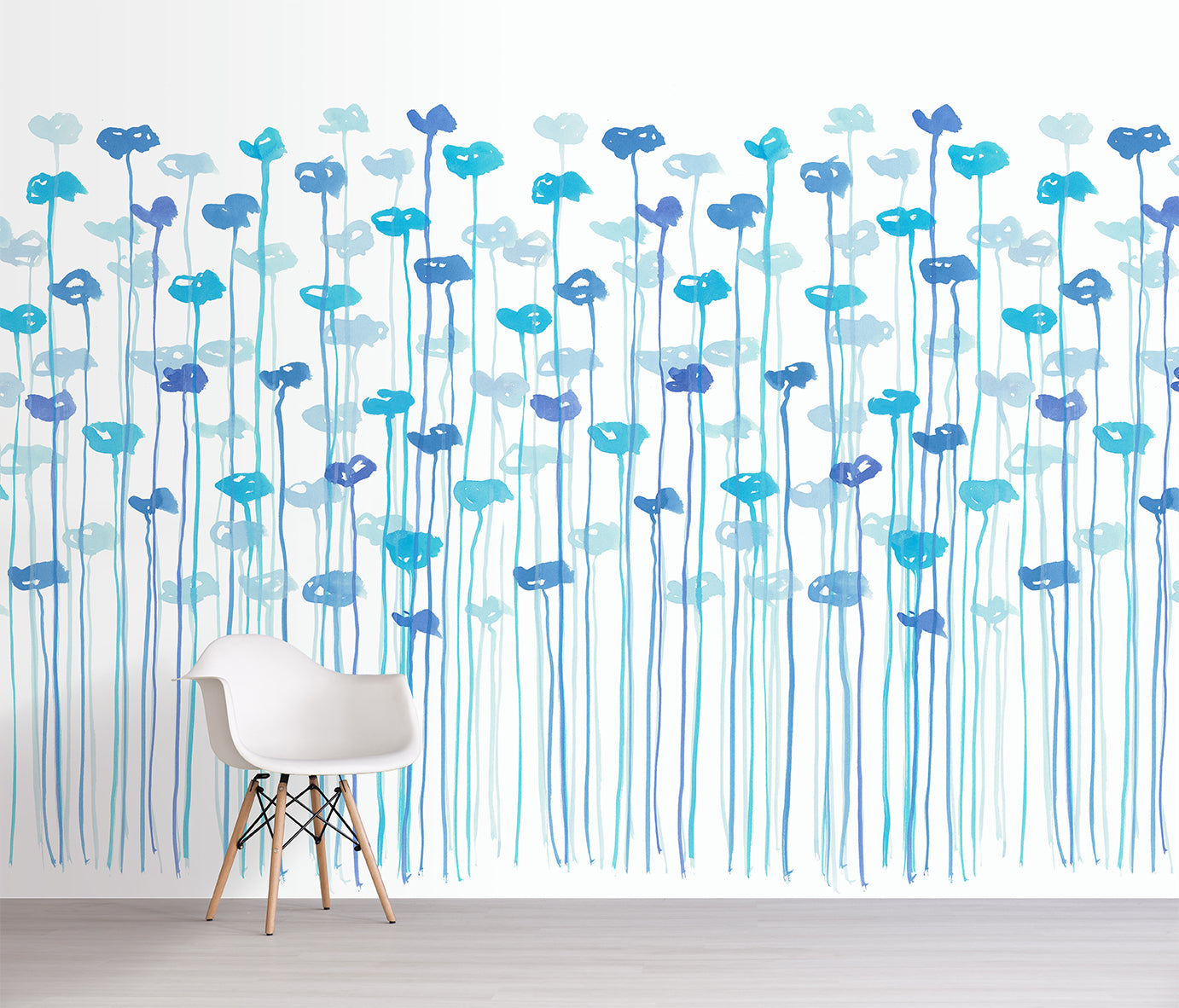 Wallpaper with blue floral pattern in a room with a chair.