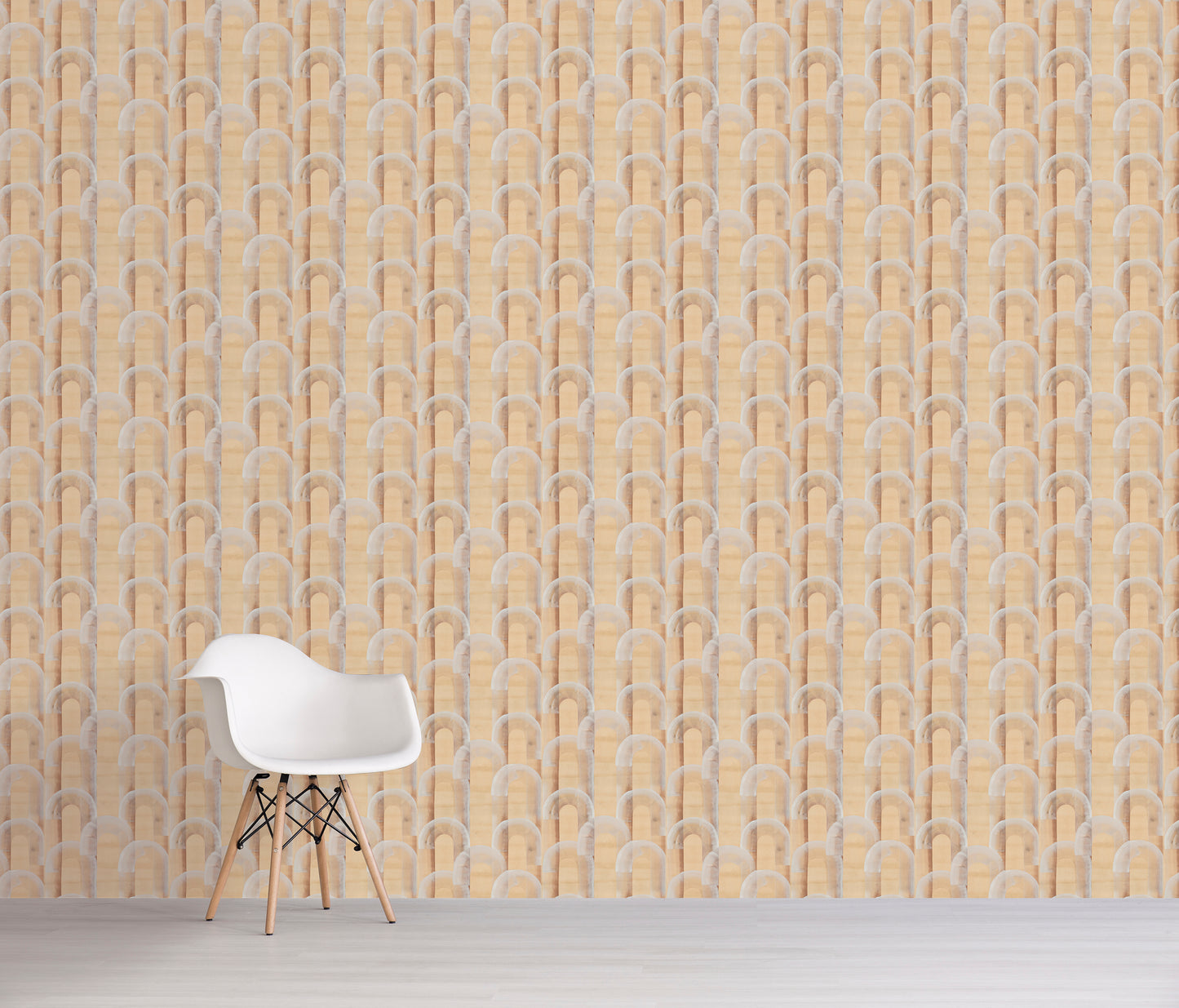 White chair in front of a beige wall with a geometric pattern