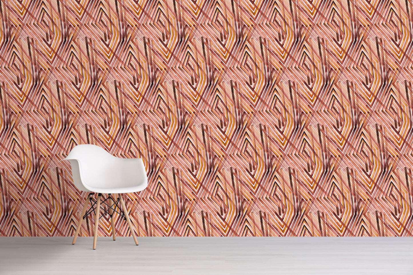 White chair against a wall with an orange geometric pattern