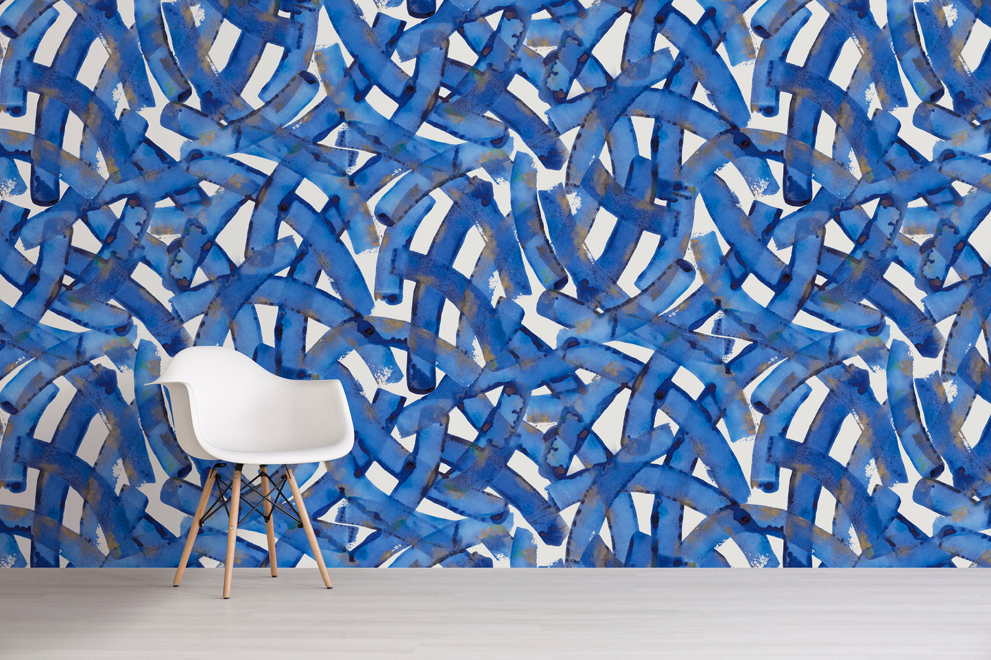 Wallpaper with blue abstract pattern in a room with a white chair.