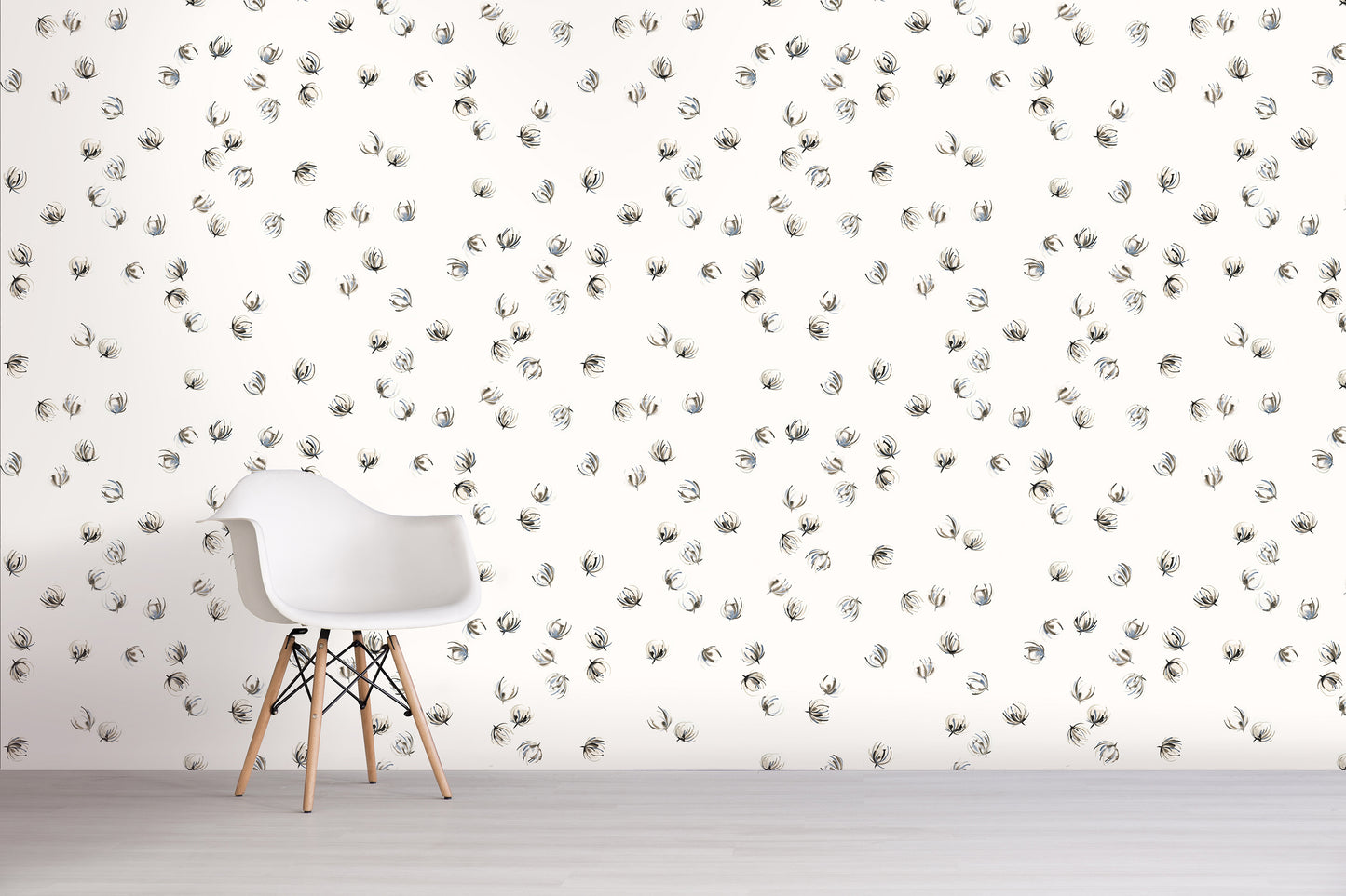White chair in front of a wall with gray floral pattern