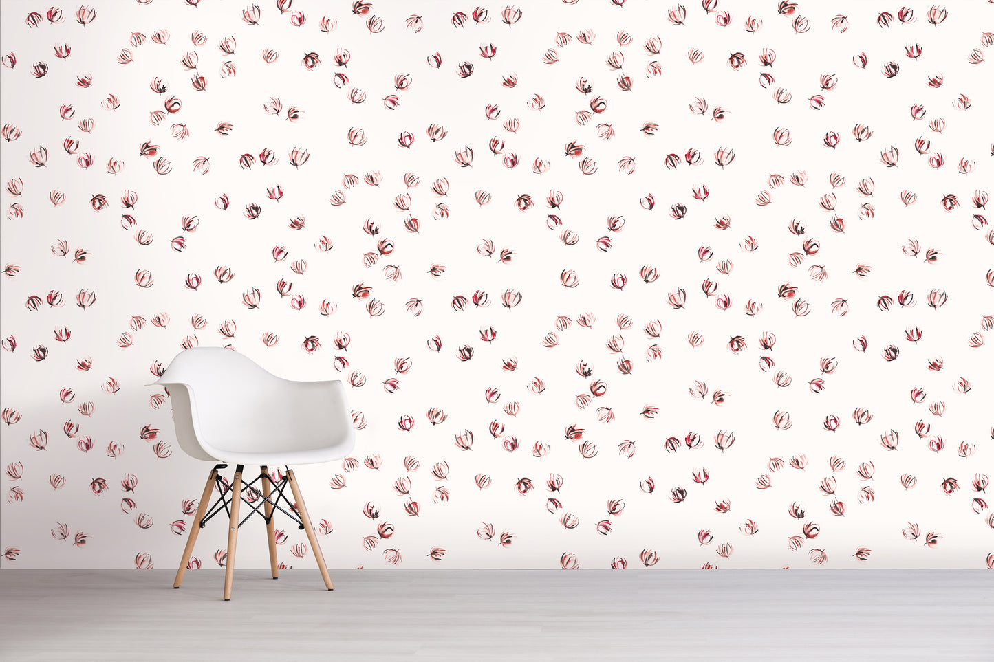 White chair in front of a wall with pink floral pattern