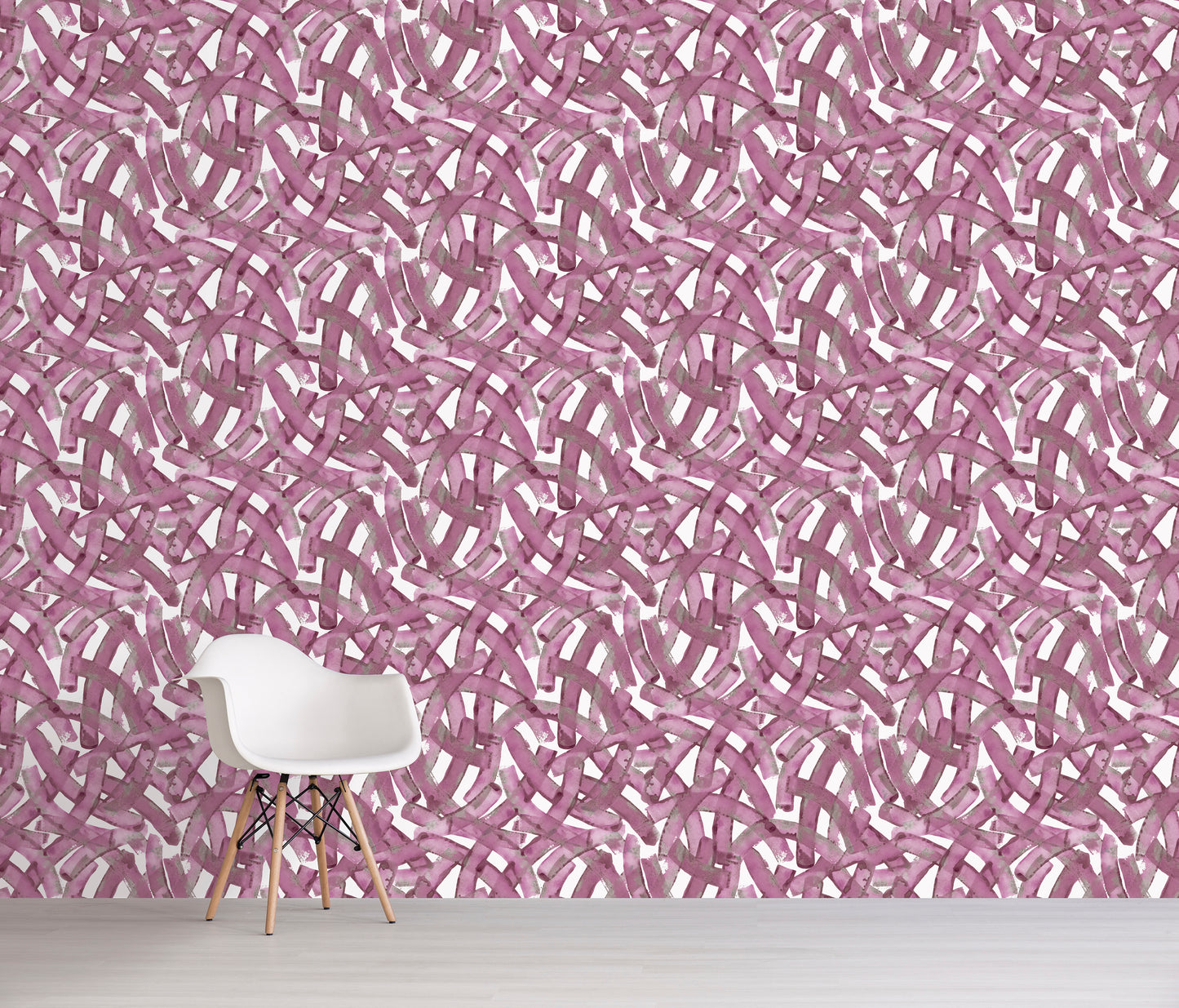 Wallpaper with a pink and white abstract pattern in a room with a white chair.