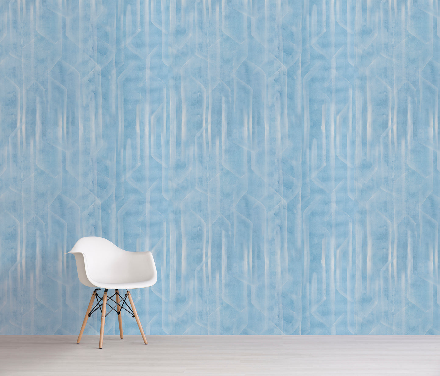 White chair against a blue patterned wall