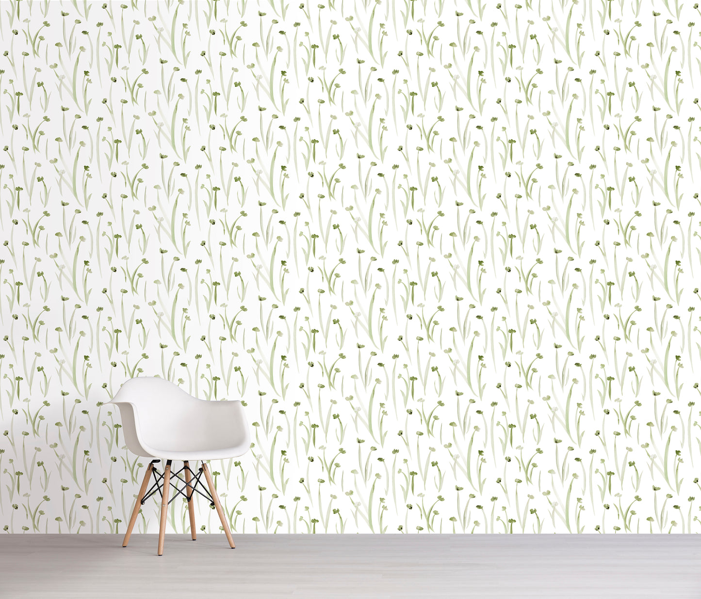 Wallpaper with subtle green floral pattern on a white wall with a chair in front.