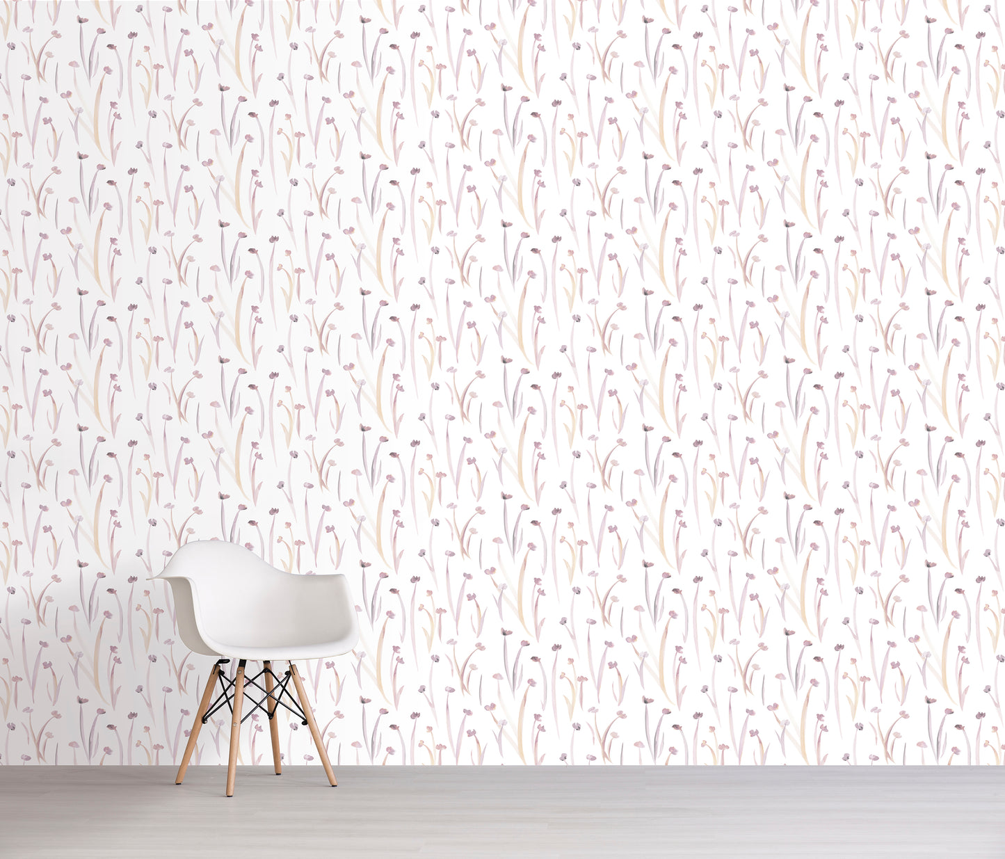 White chair against a wall with a subtle pink floral patterned wallpaper