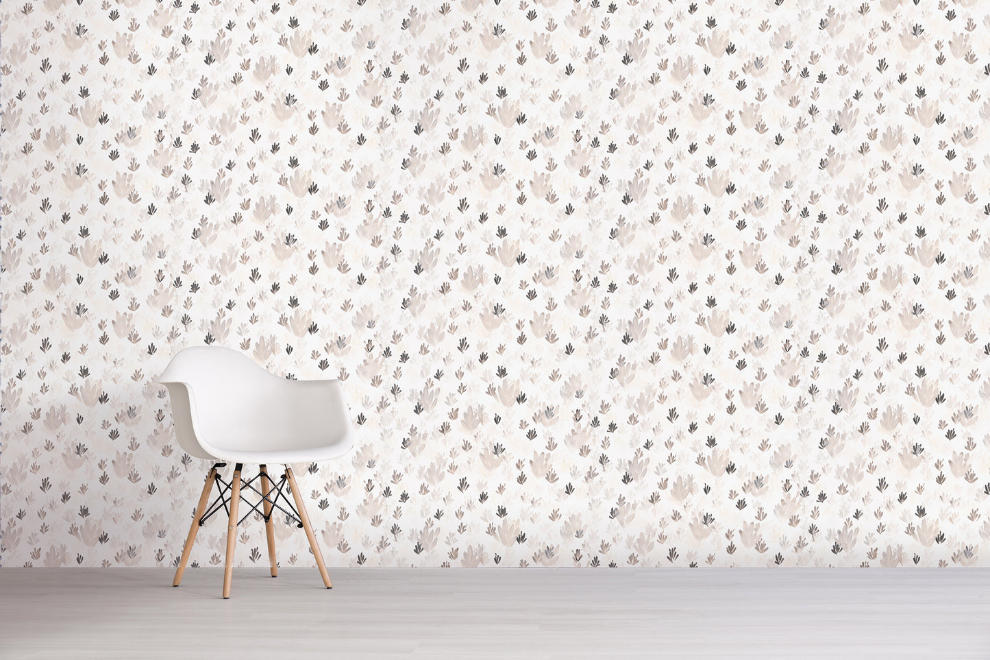 White chair against a wall with a grey floral pattern