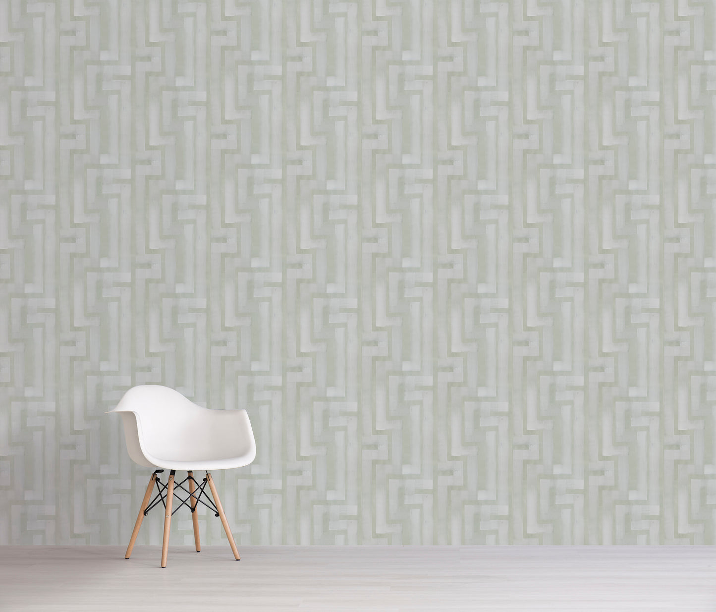 White chair against a light green geometric patterned wall