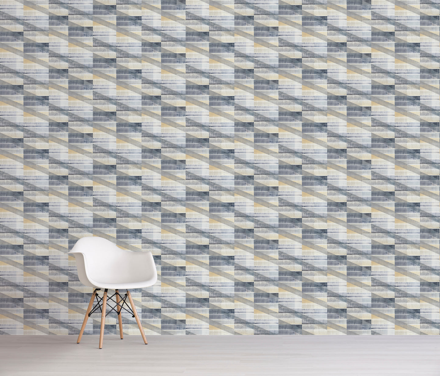 Blue and grey tile pattern on wall with white chair