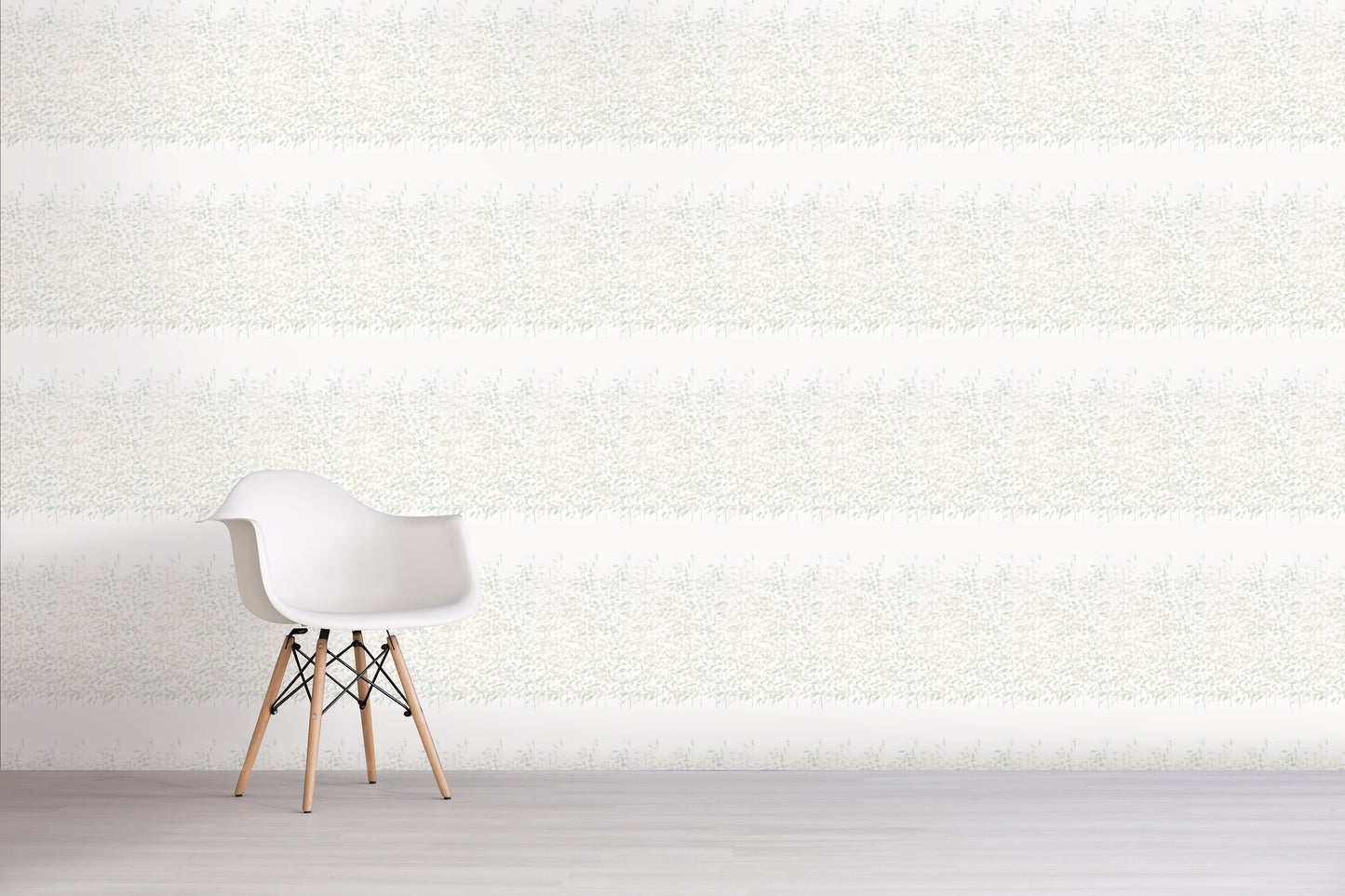 White chair against a green floral textured white wall