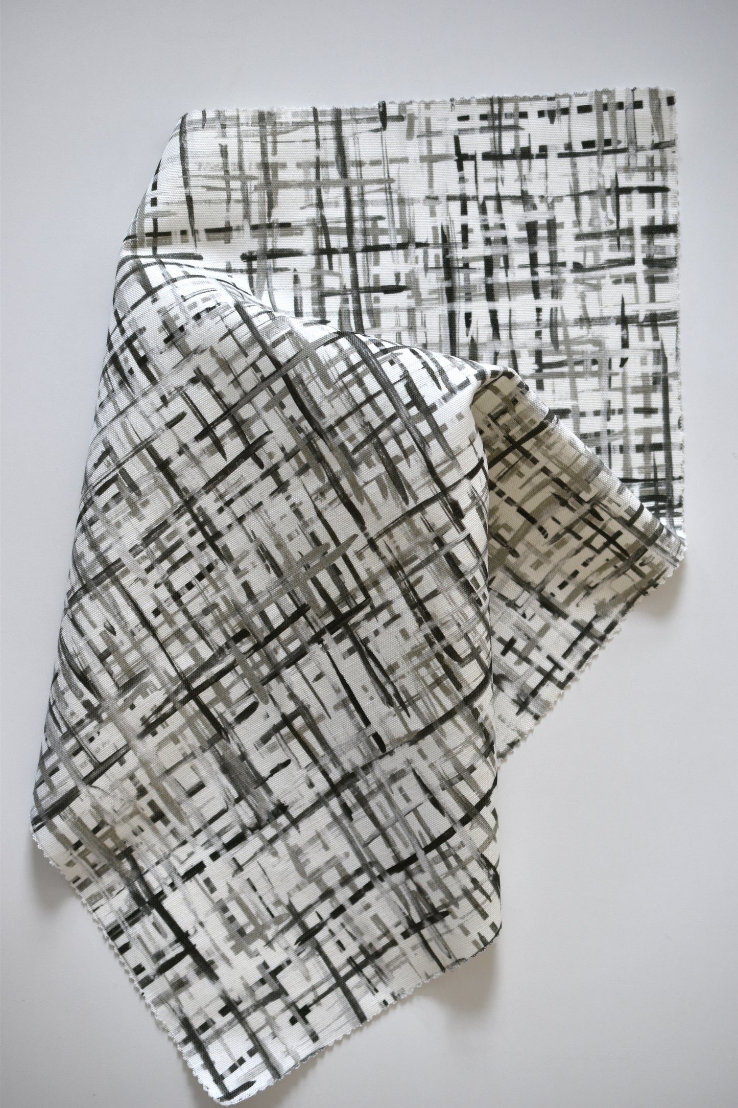 Textile with geometric pattern on a plain background