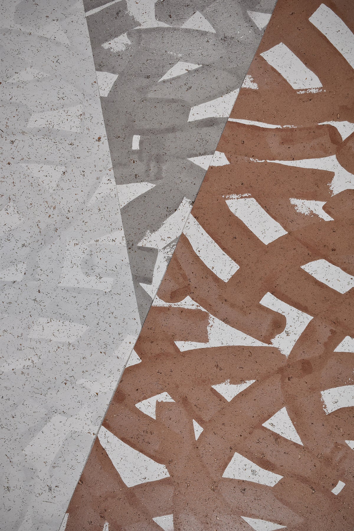 Geometric patterns on textured cork wallpaper