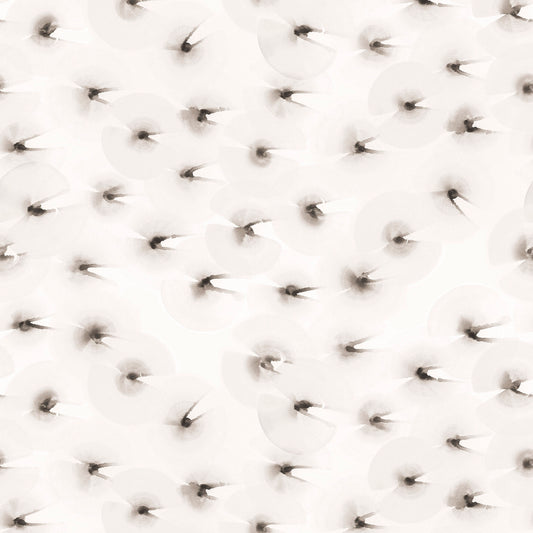 Close-up of a textured white surface with small brown orbs.