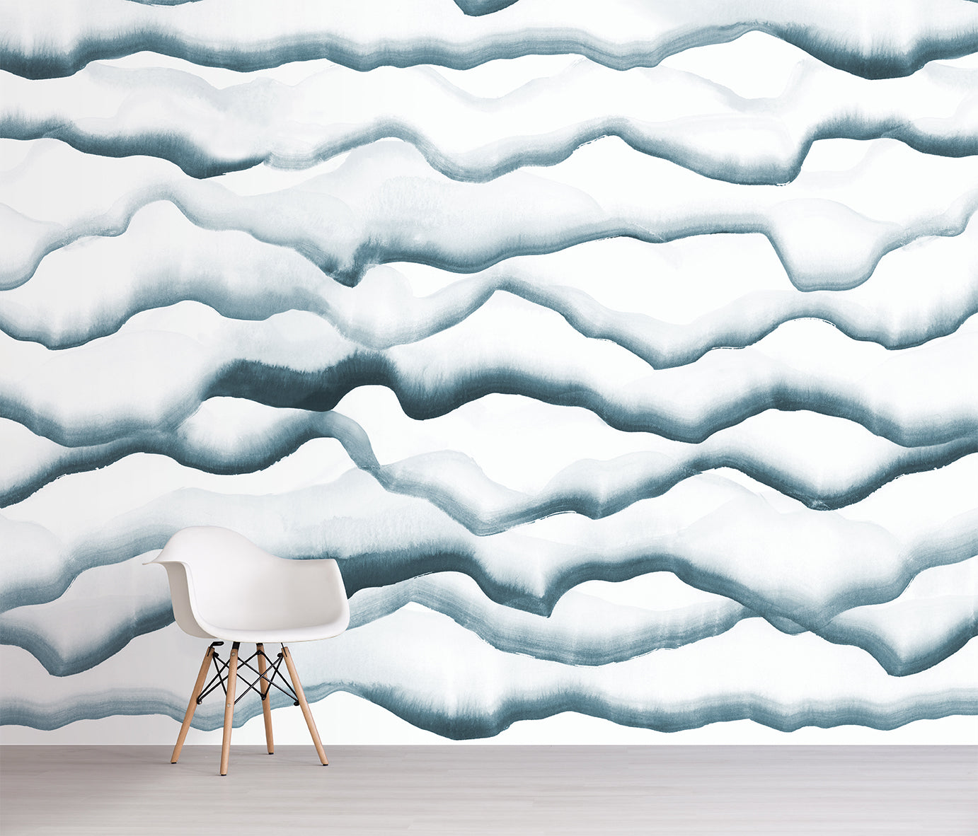 Wallpaper with blue wavy cloud pattern in a room with a chair.