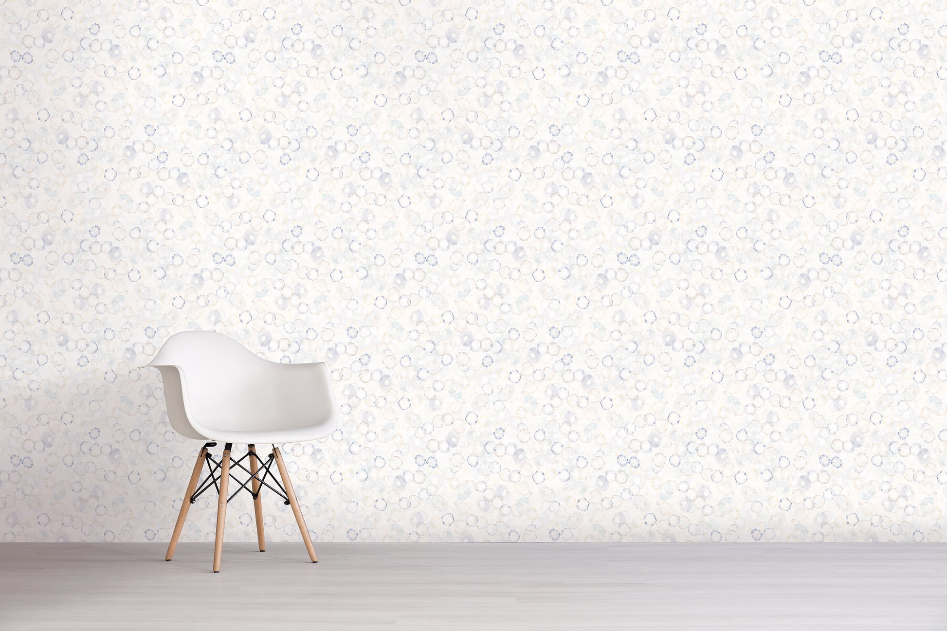 White chair against a light blue and gray wall with subtle pattern