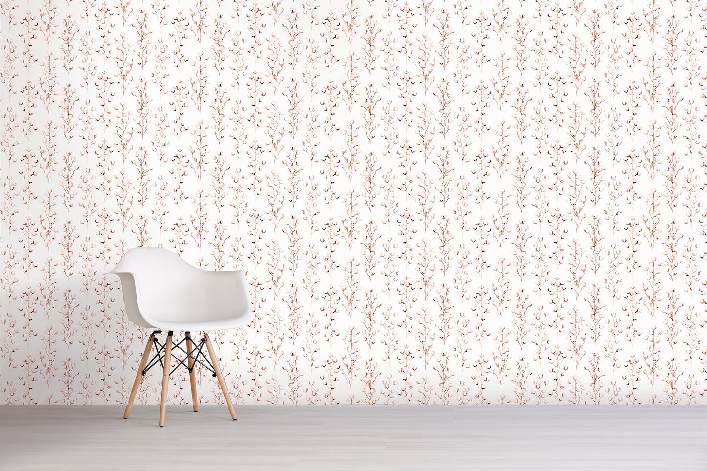 White chair against a light pink floral patterned wall.