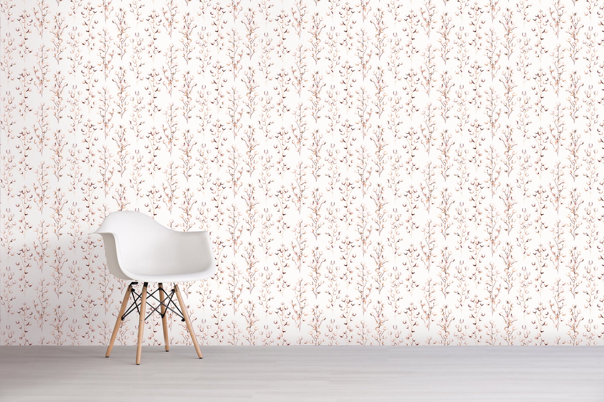 White chair against a light pink floral patterned wall.