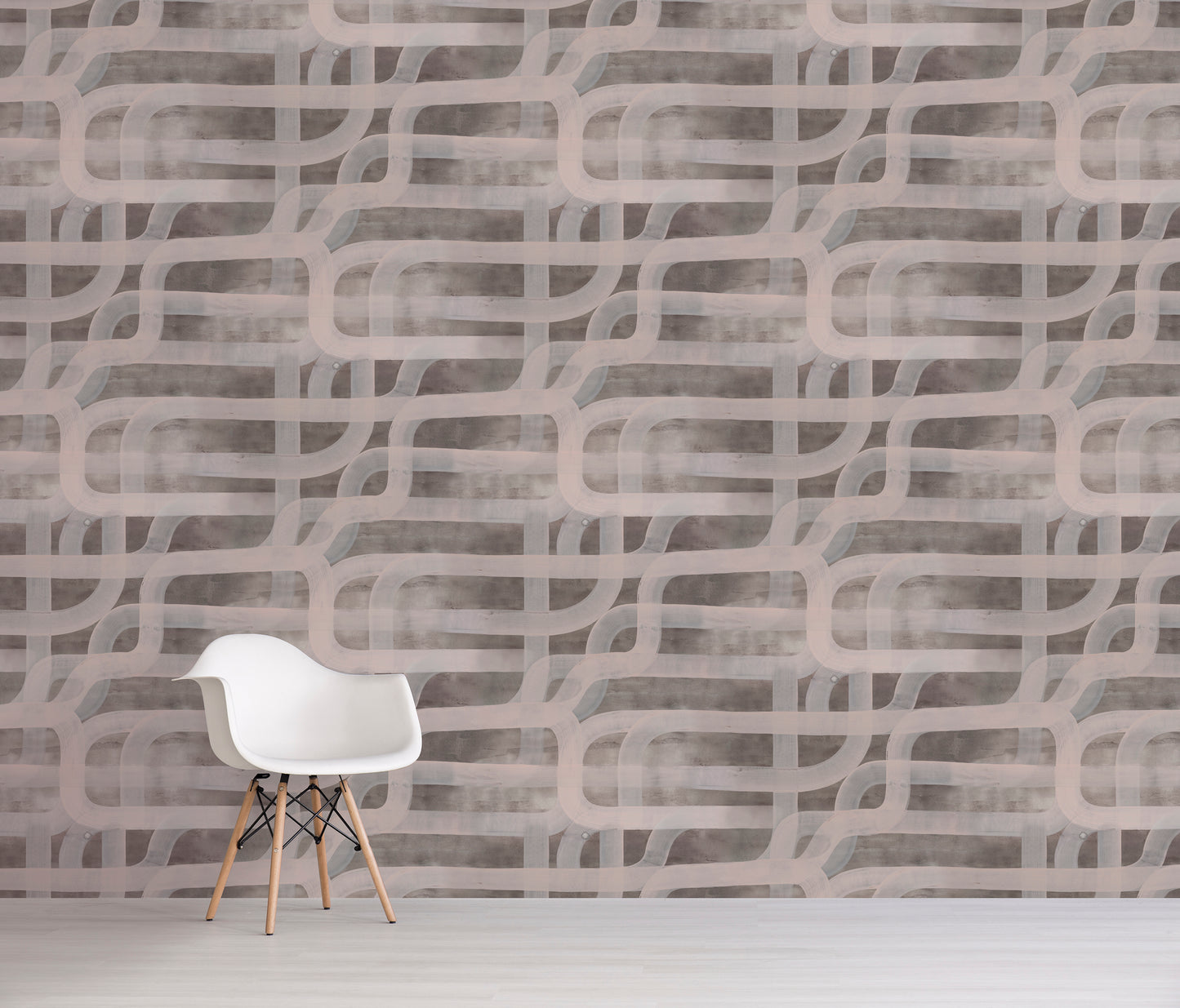 White chair in front of a brown textured wall with wavy patterns