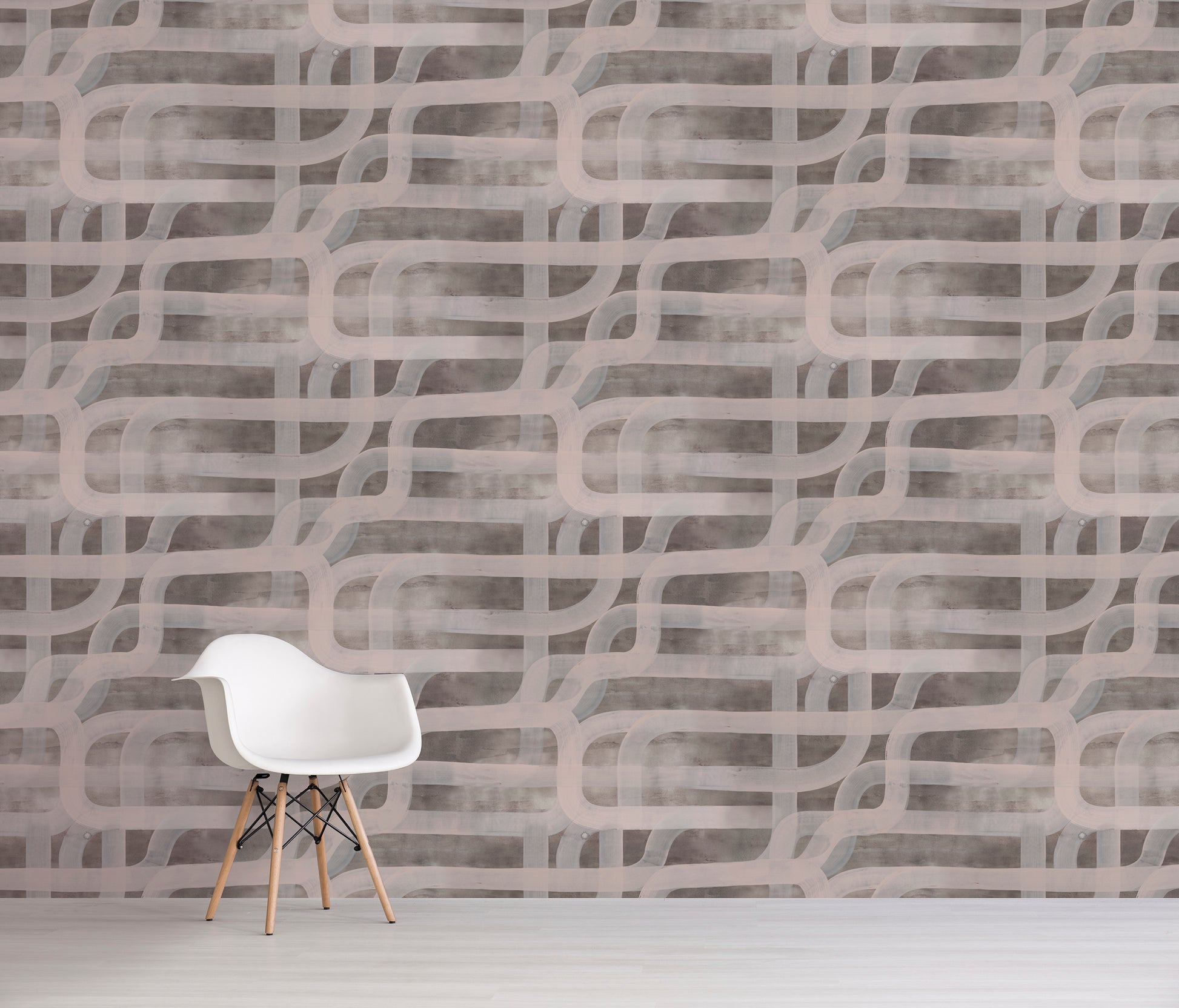 White chair in front of a brown textured wall with wavy patterns