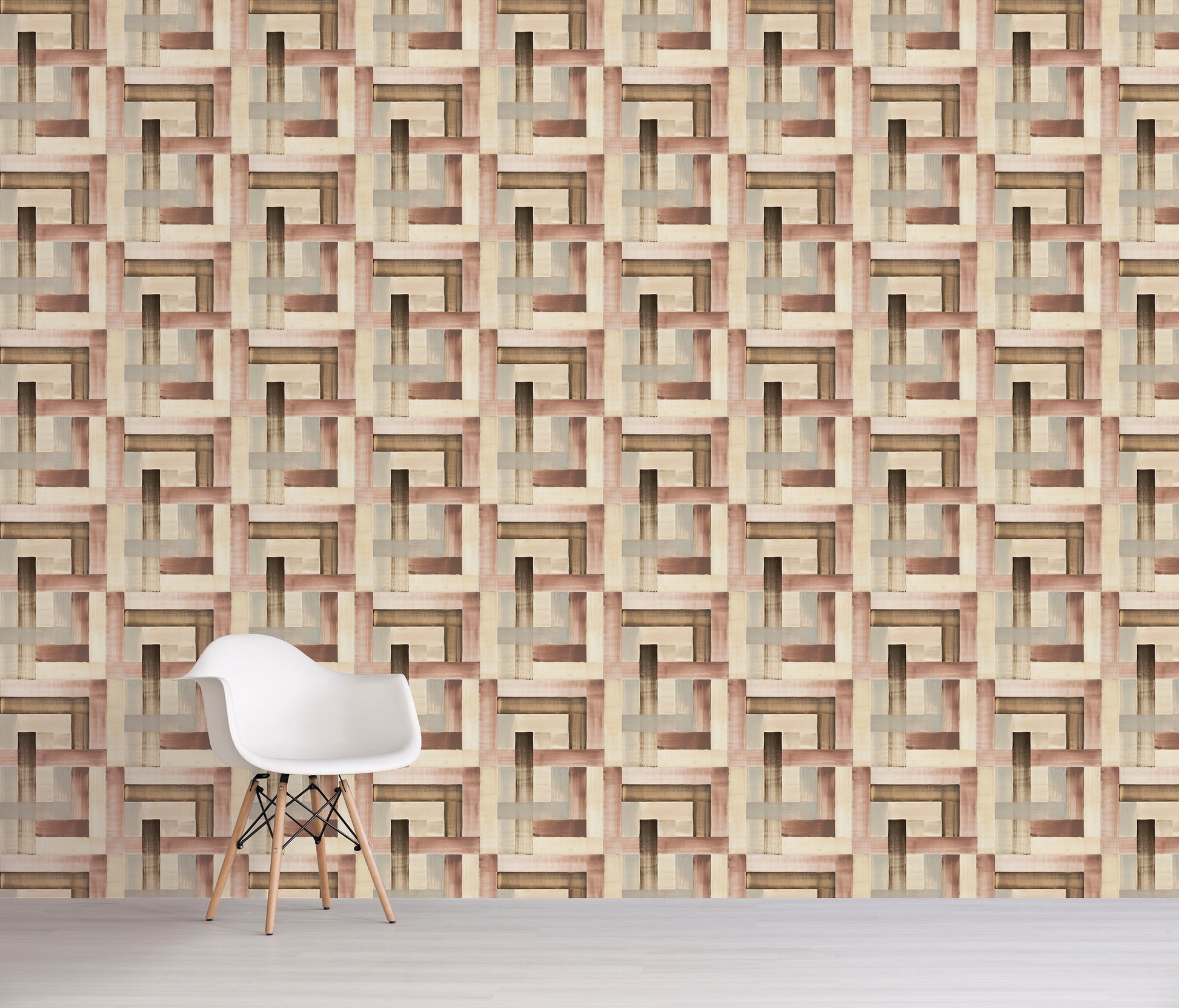 White chair in front of a brown geometric patterned wall.
