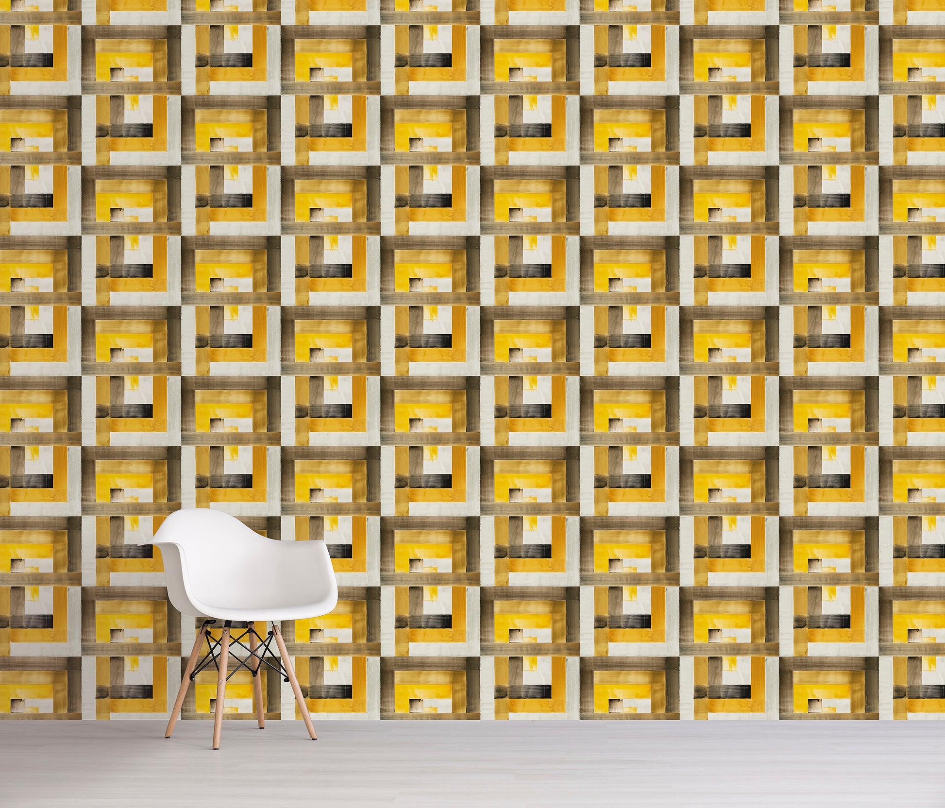 Wall with geometric yellow and gray pattern and a white chair in front.