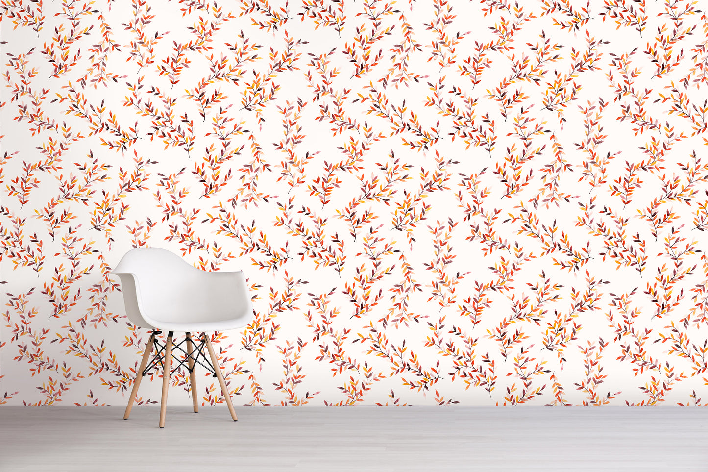 White chair in front of a wall with an orange floral pattern