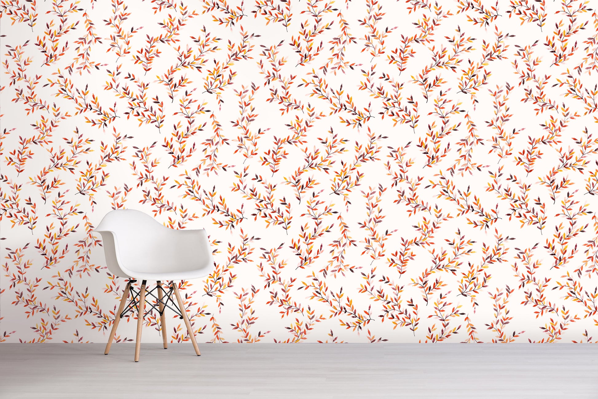 White chair in front of a wall with an orange floral pattern