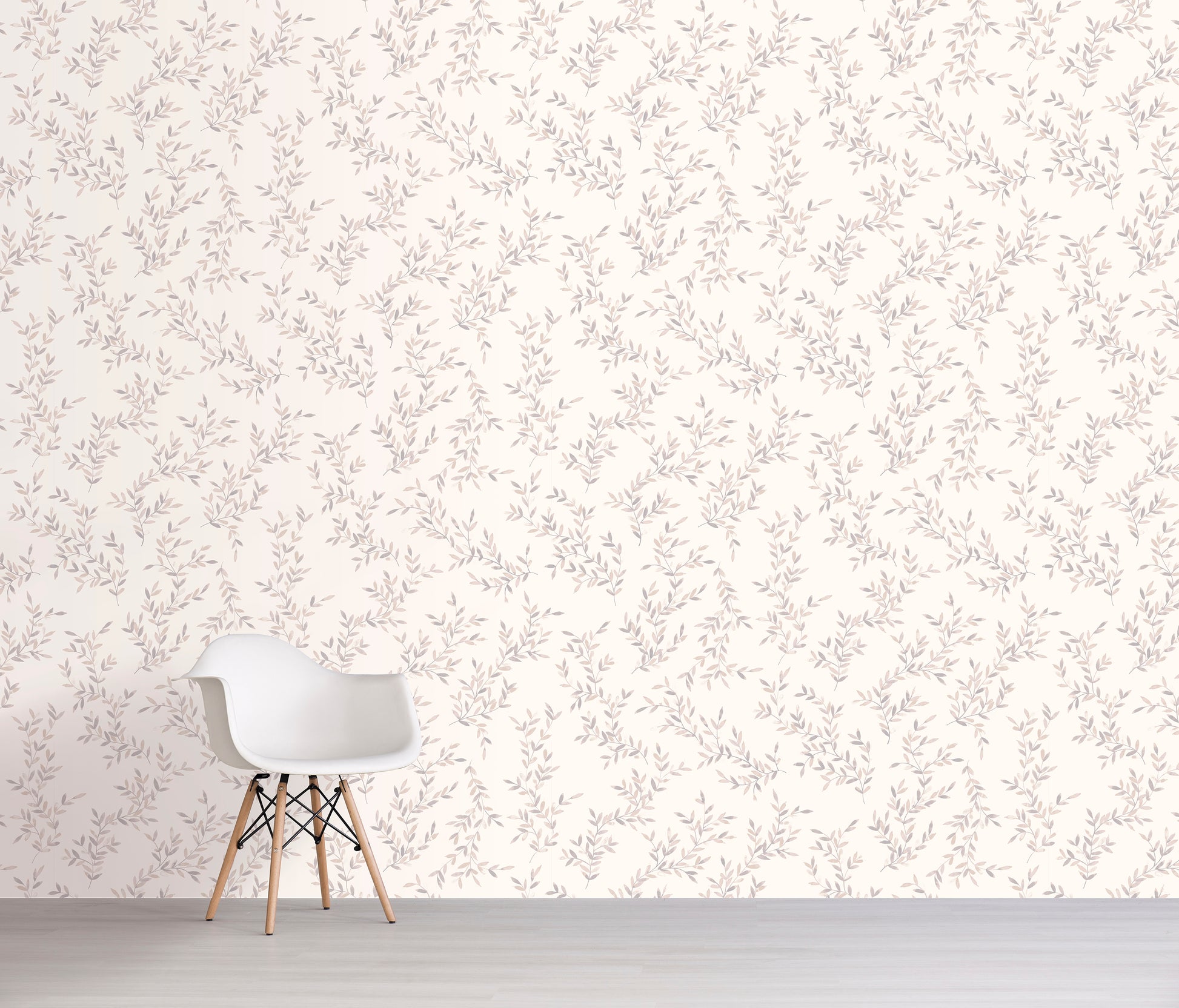 White chair against a cream floral patterned wall.