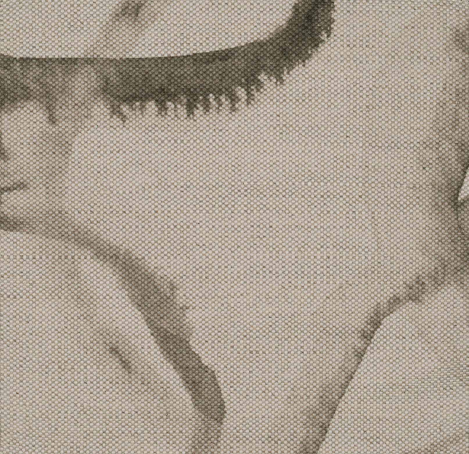 Circular brown pattern on beige fabric