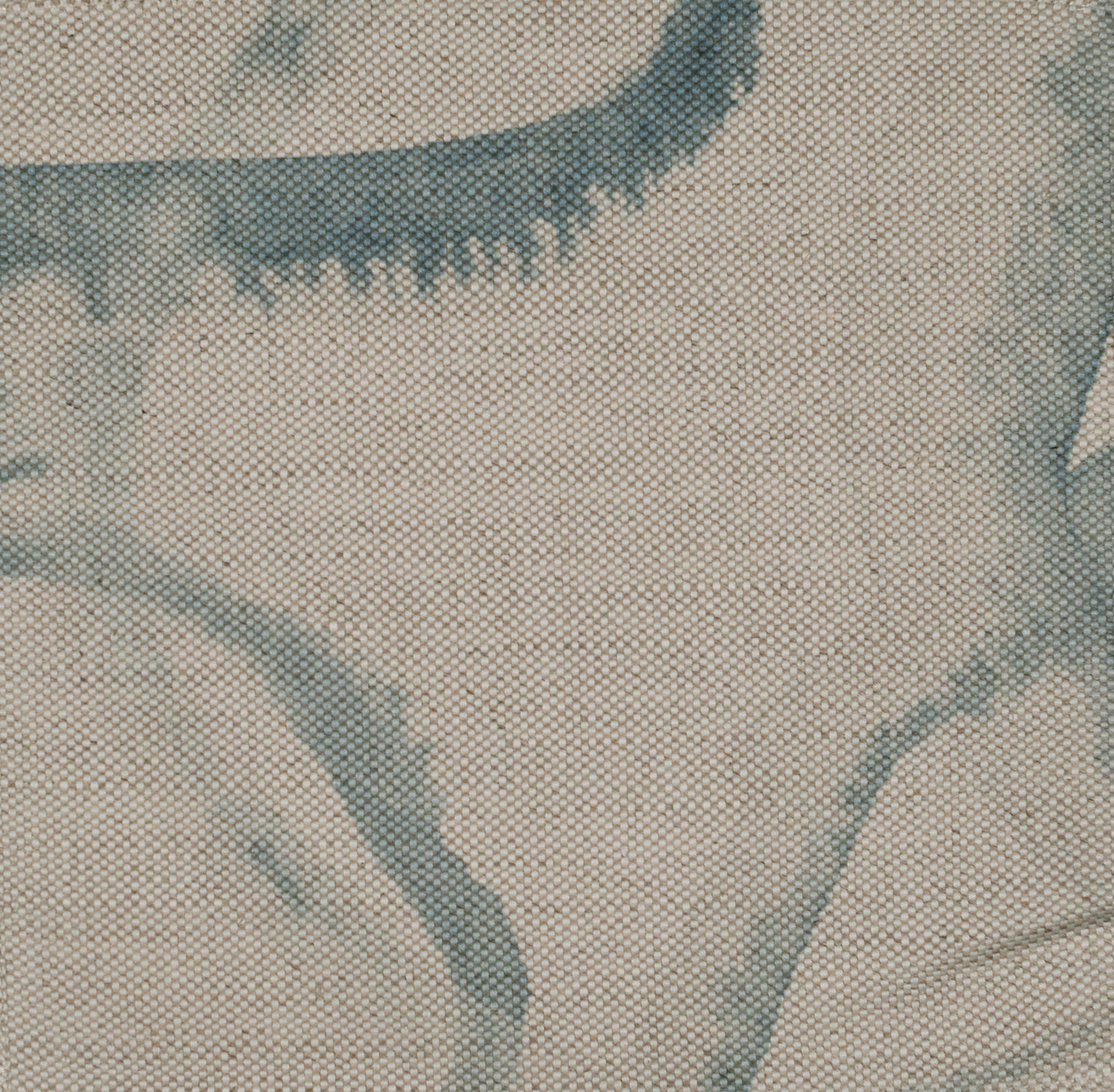Circular blue pattern on beige fabric