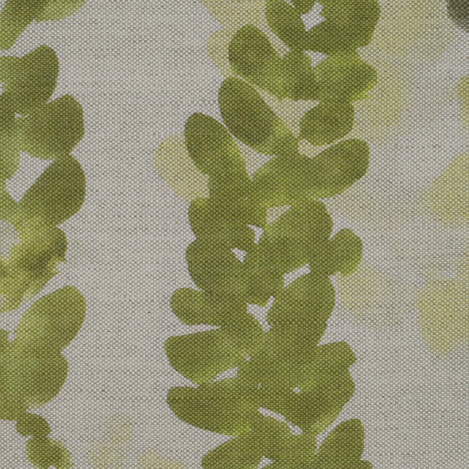 Fabric with green leaf pattern on a oatmeal background
