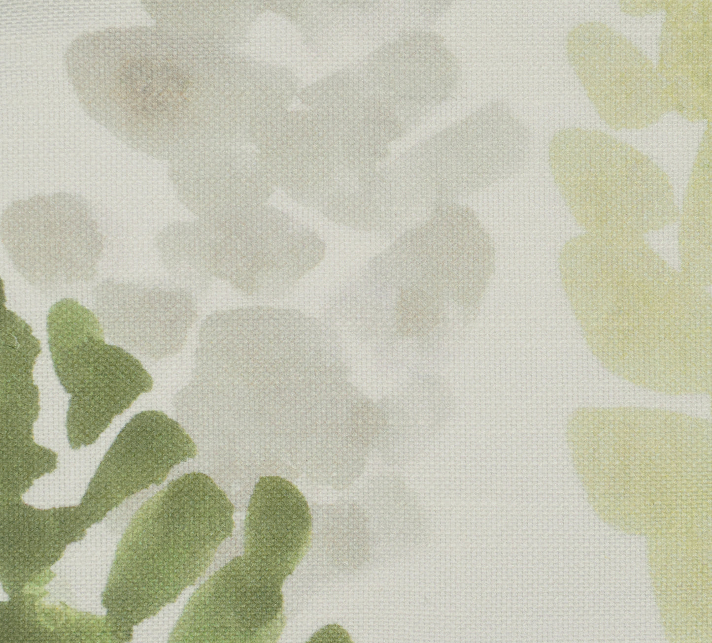 Green floral leaves on light fabric
