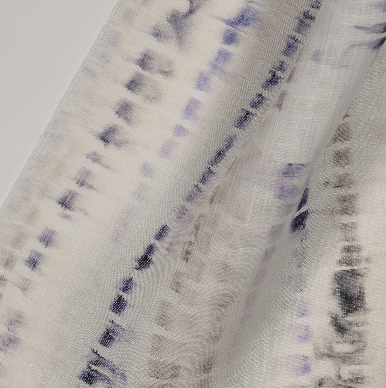 Blue and black textured pattern on a light sheer fabric