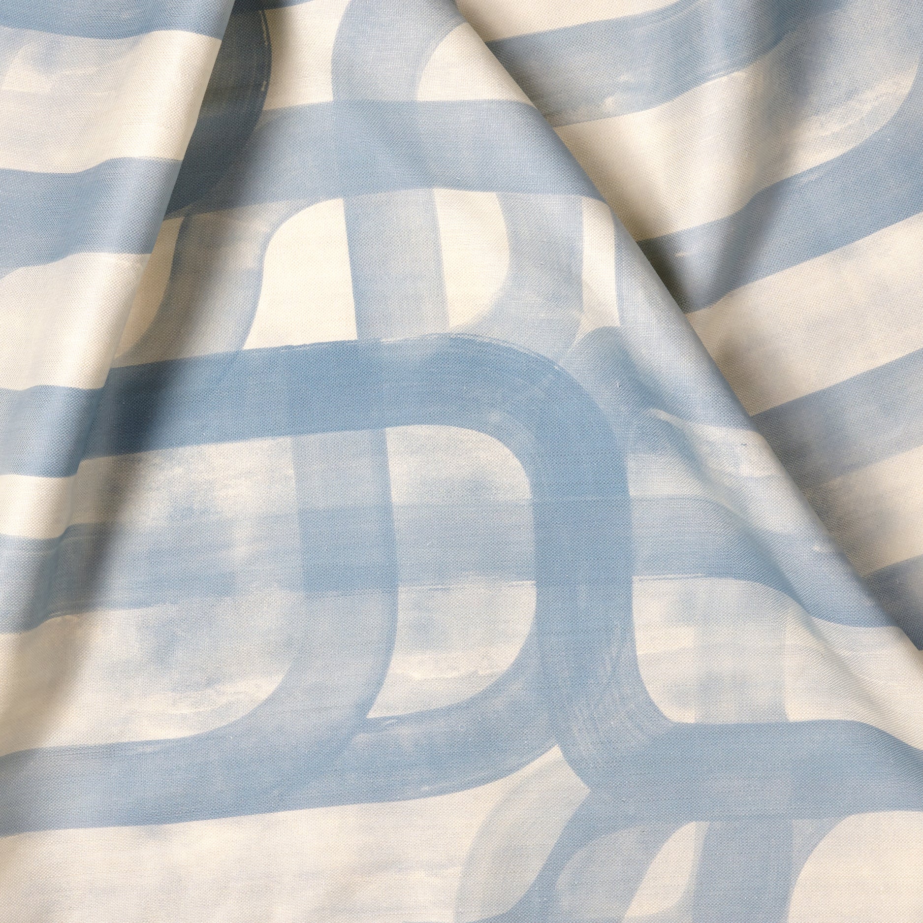 Sheer fabric with blue and white striped pattern