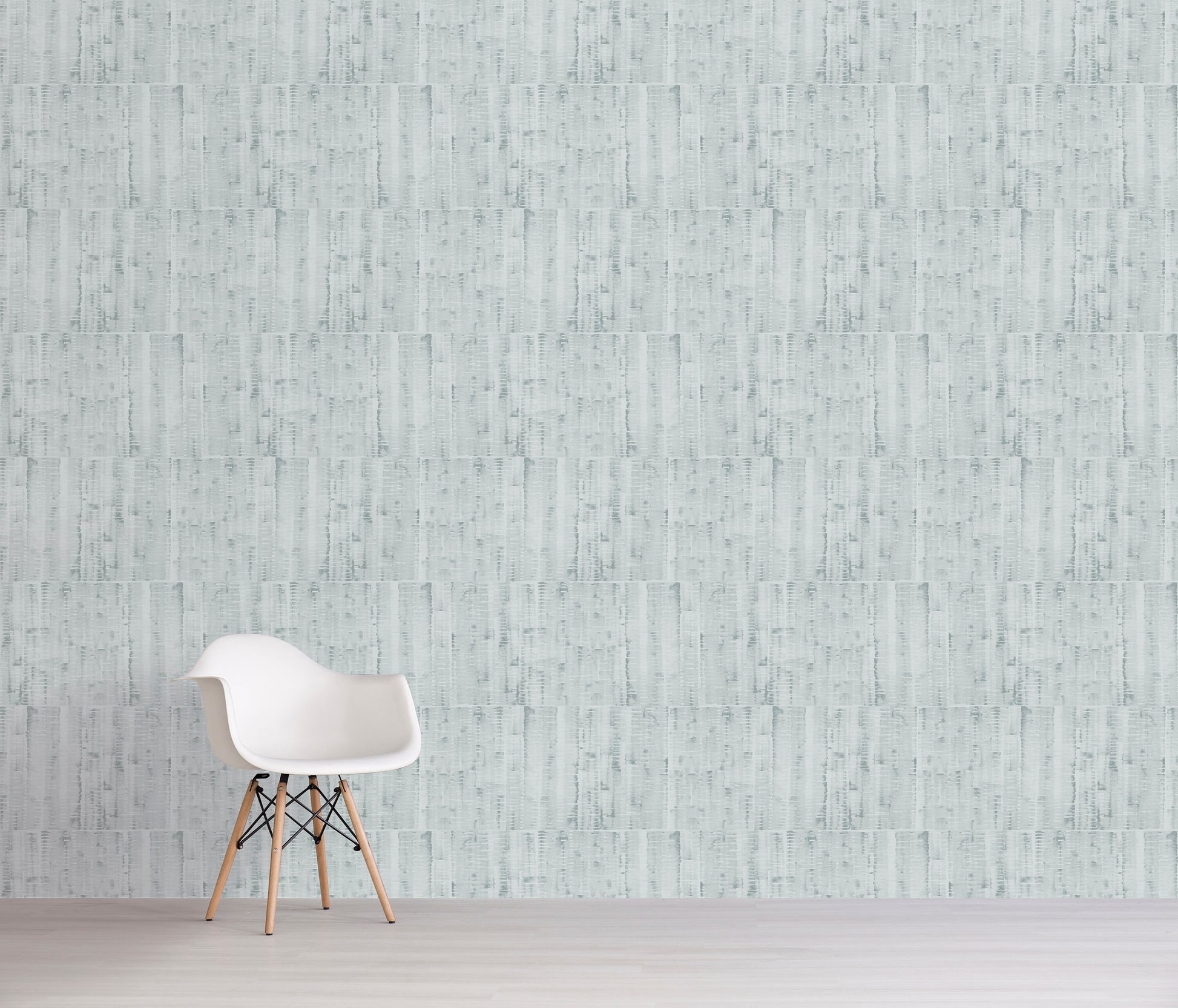 White chair against a light gray textured wall