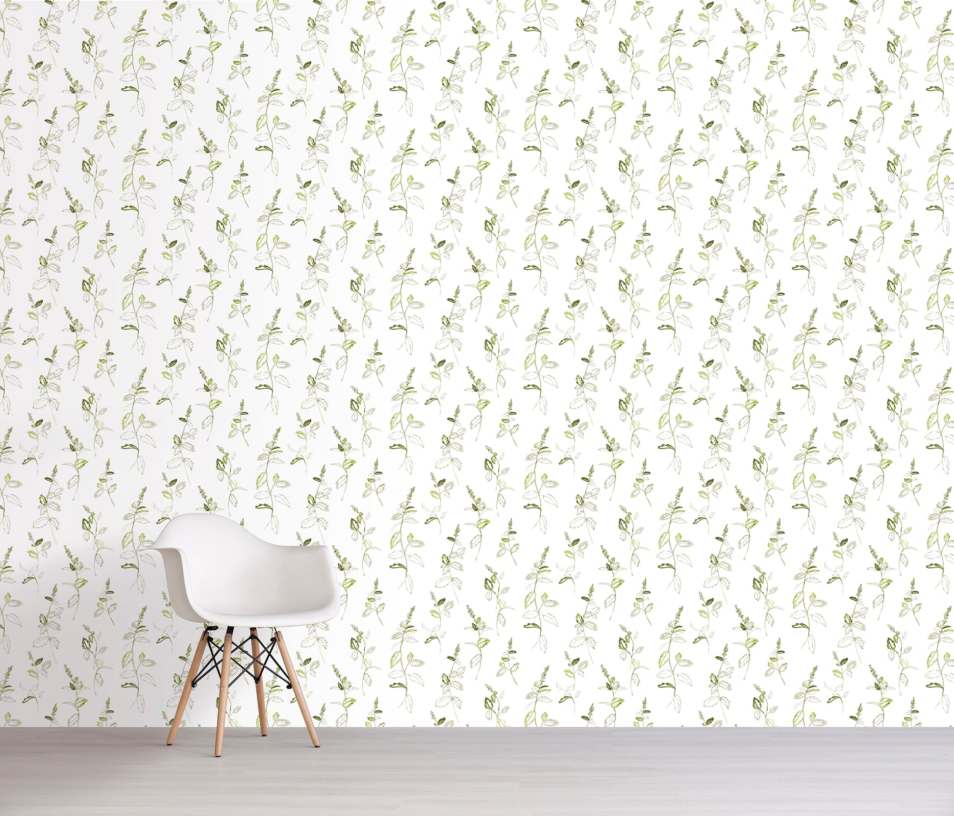 White chair in front of a wall with light green floral pattern